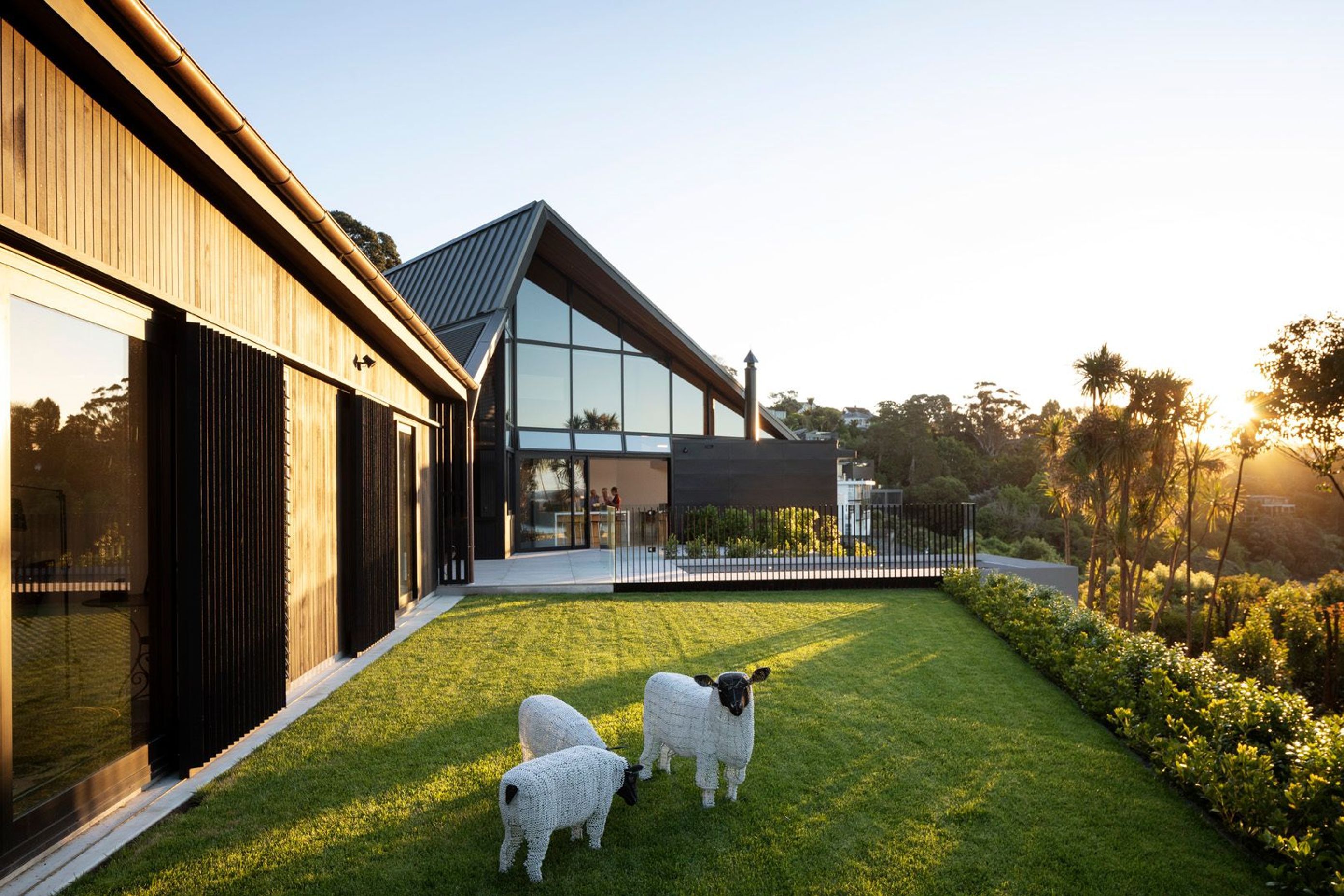 The site originally had a one-in-three slope so to create the desired flat area the cliff face behind the house was cut into—albeit minimally—and the downhill portion was lifted and retained.