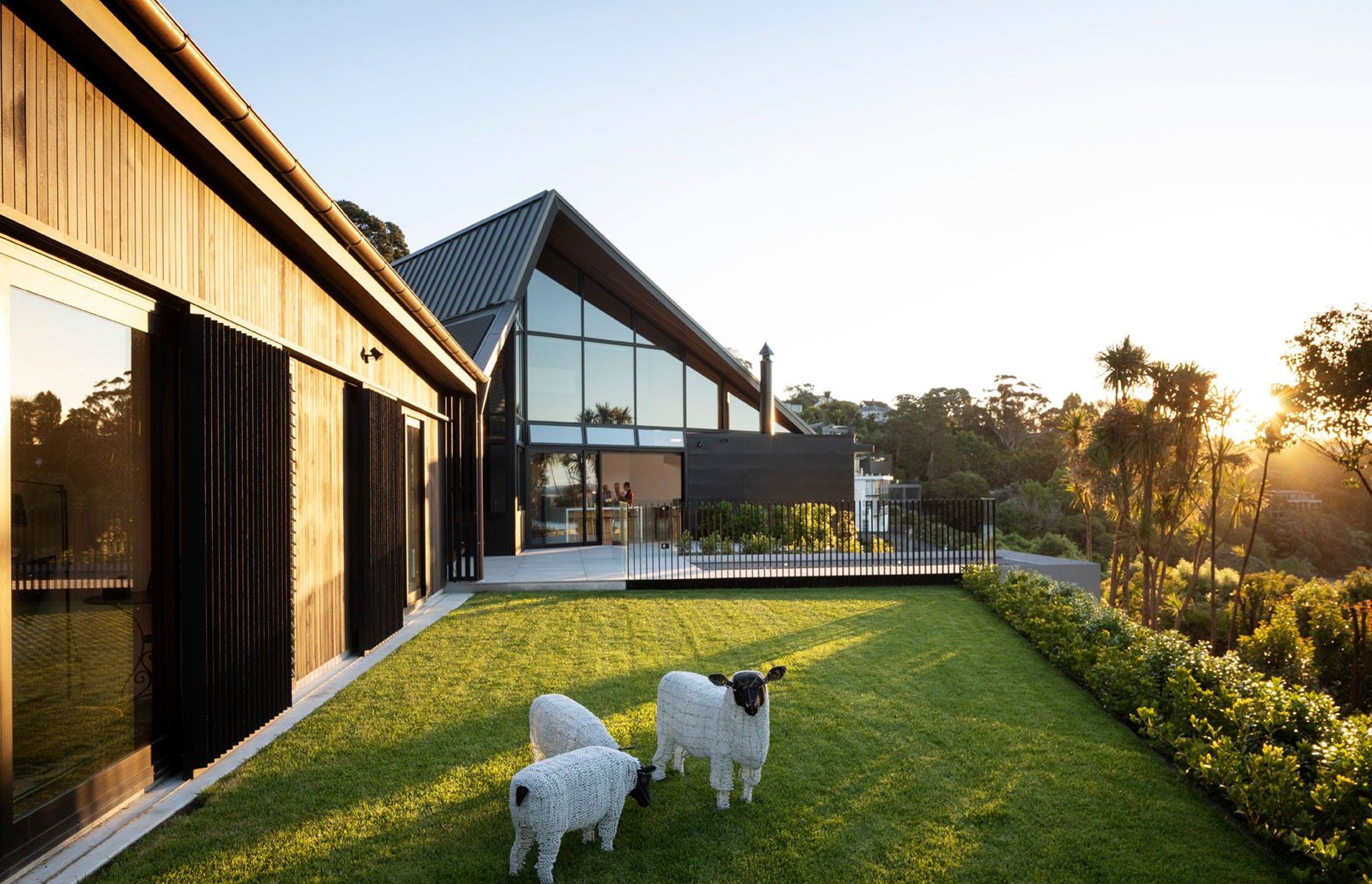 The site originally had a one-in-three slope so to create the desired flat area the cliff face behind the house was cut into—albeit minimally—and the downhill portion was lifted and retained.