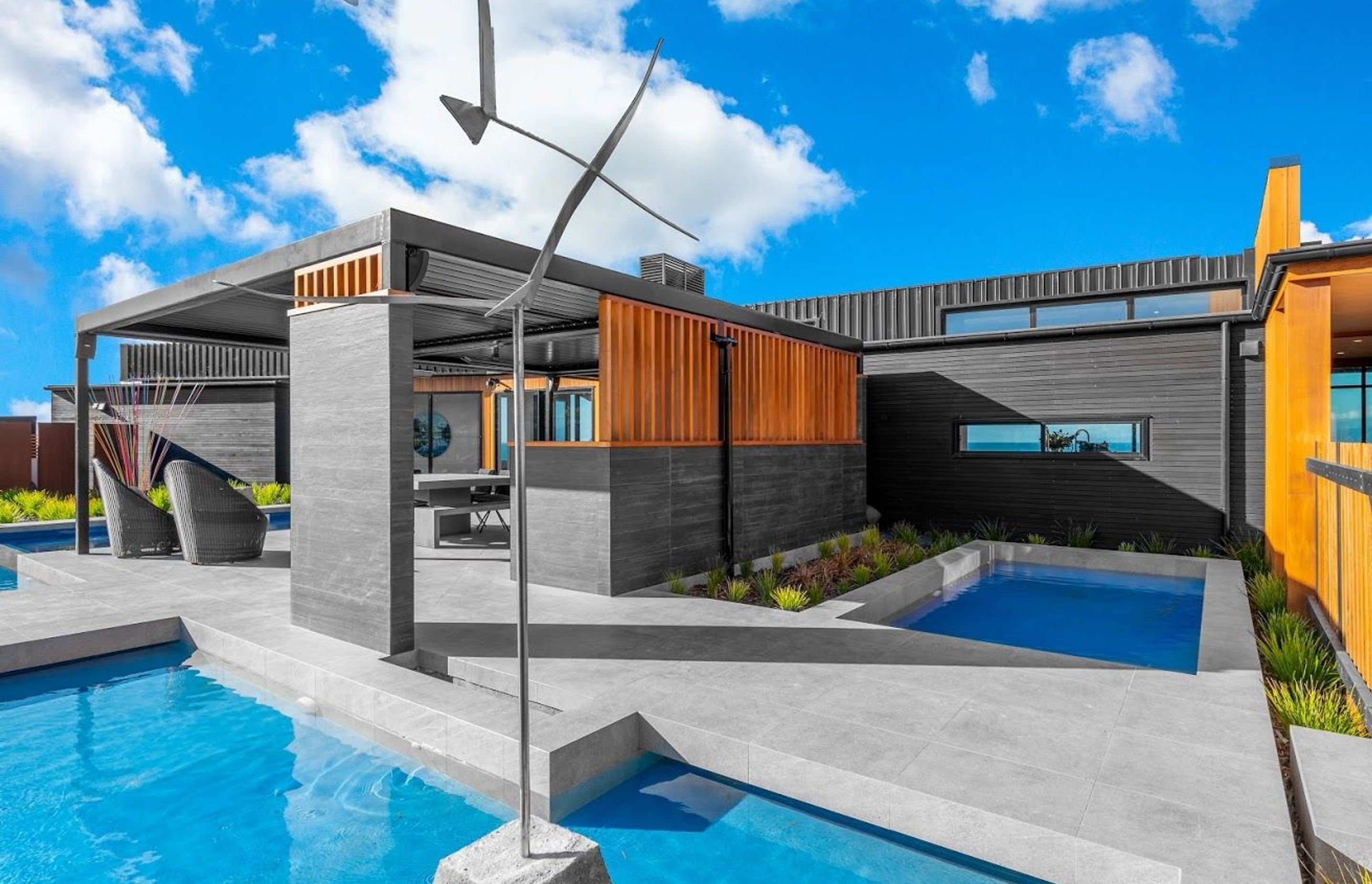 As you walk in along the boardwalk to the right, visitors can enjoy an elegant water feature in the pool area.