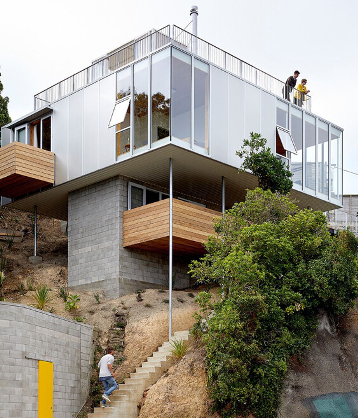 The rooftop peeks out over the surrounding trees.