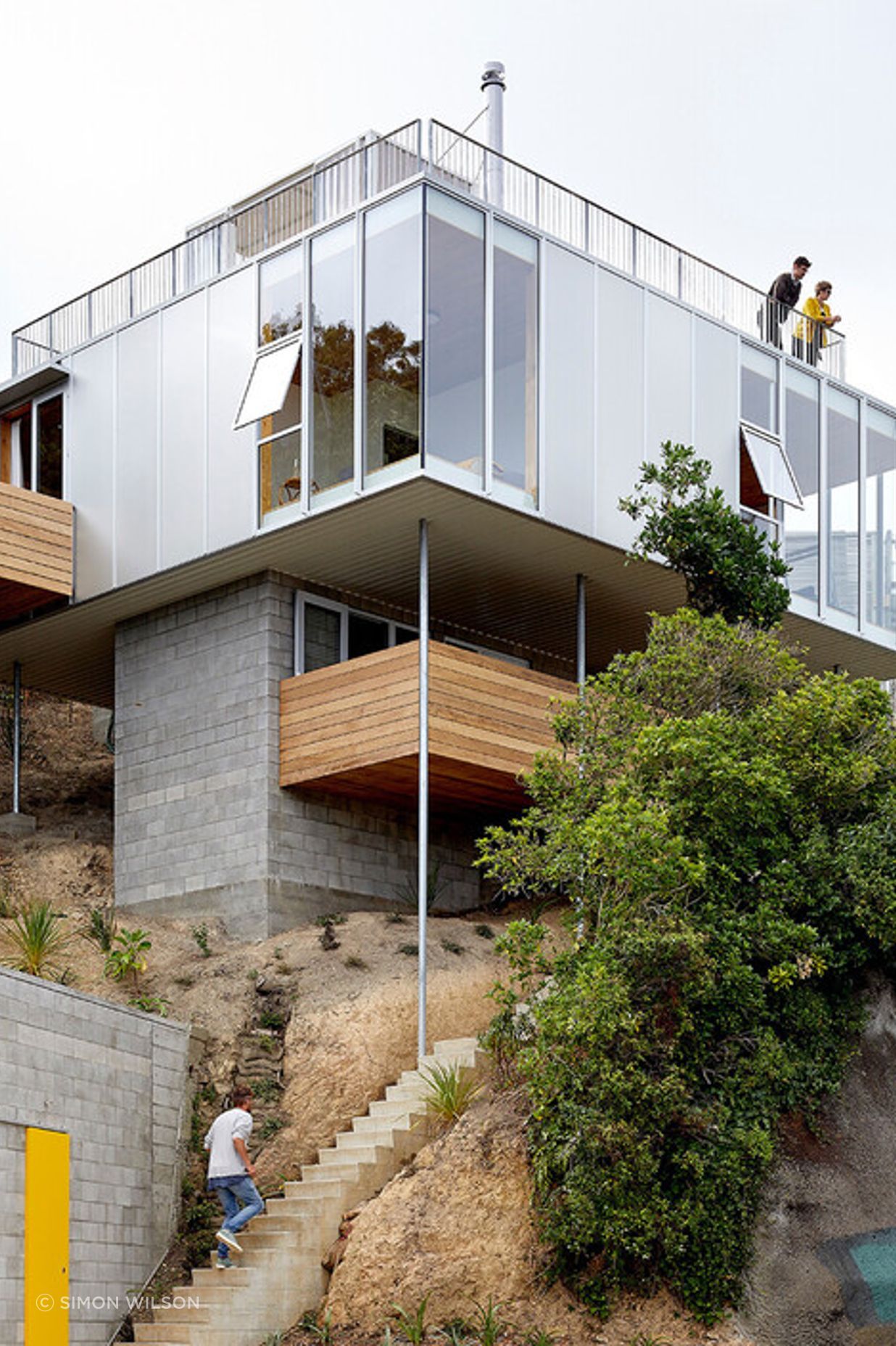 The rooftop peeks out over the surrounding trees.