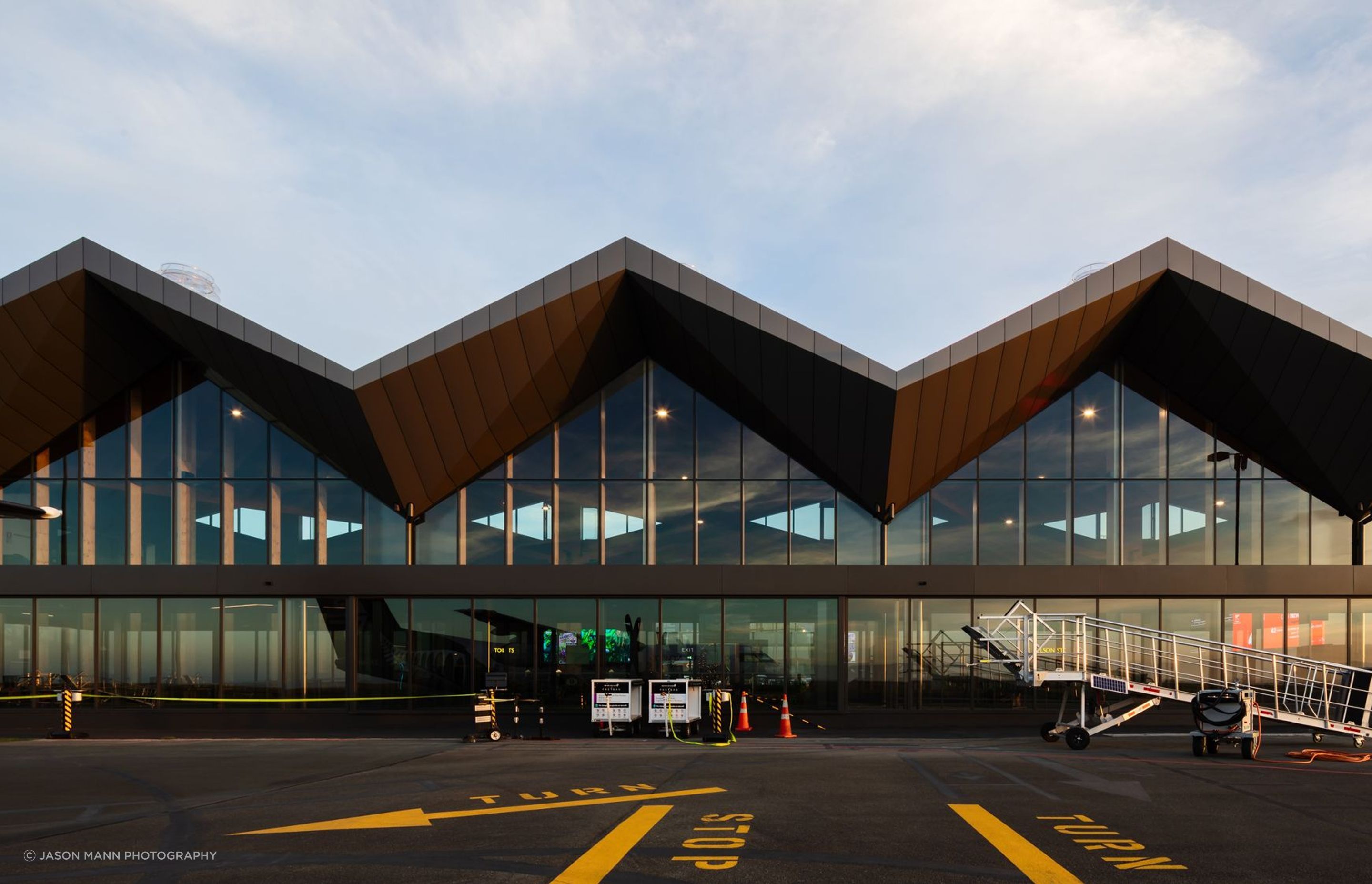 The diagonal forms reference the mountain range panorama as seen from Tasman Bay.