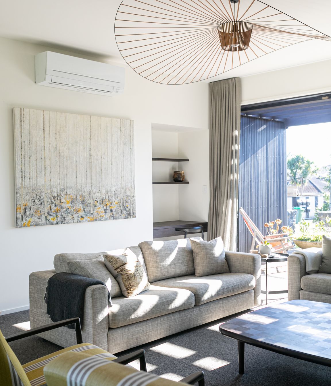 A separate sitting area includes a built-in study nook.
