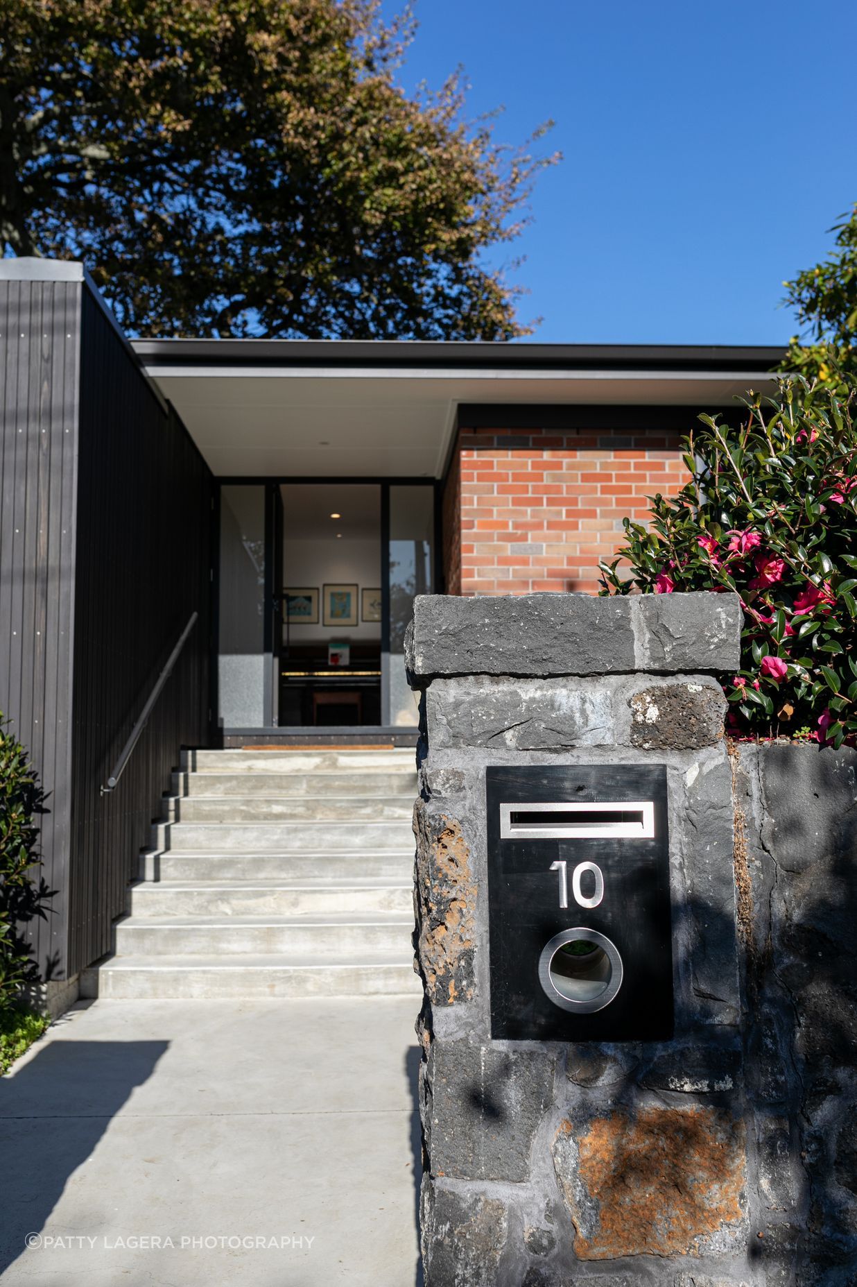 The contrast of old and new is experienced from the front of the dwelling.