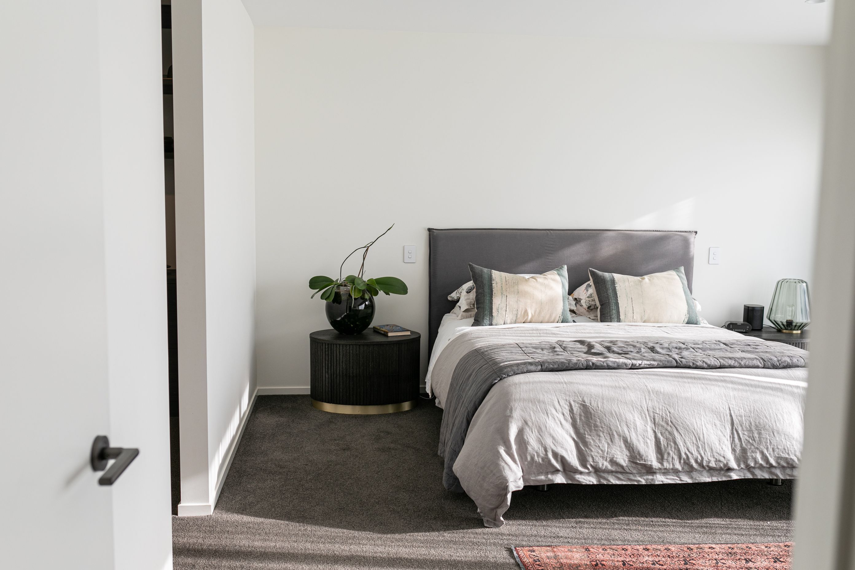 Neutral tones help the master bedroom to feel like a peaceful retreat.