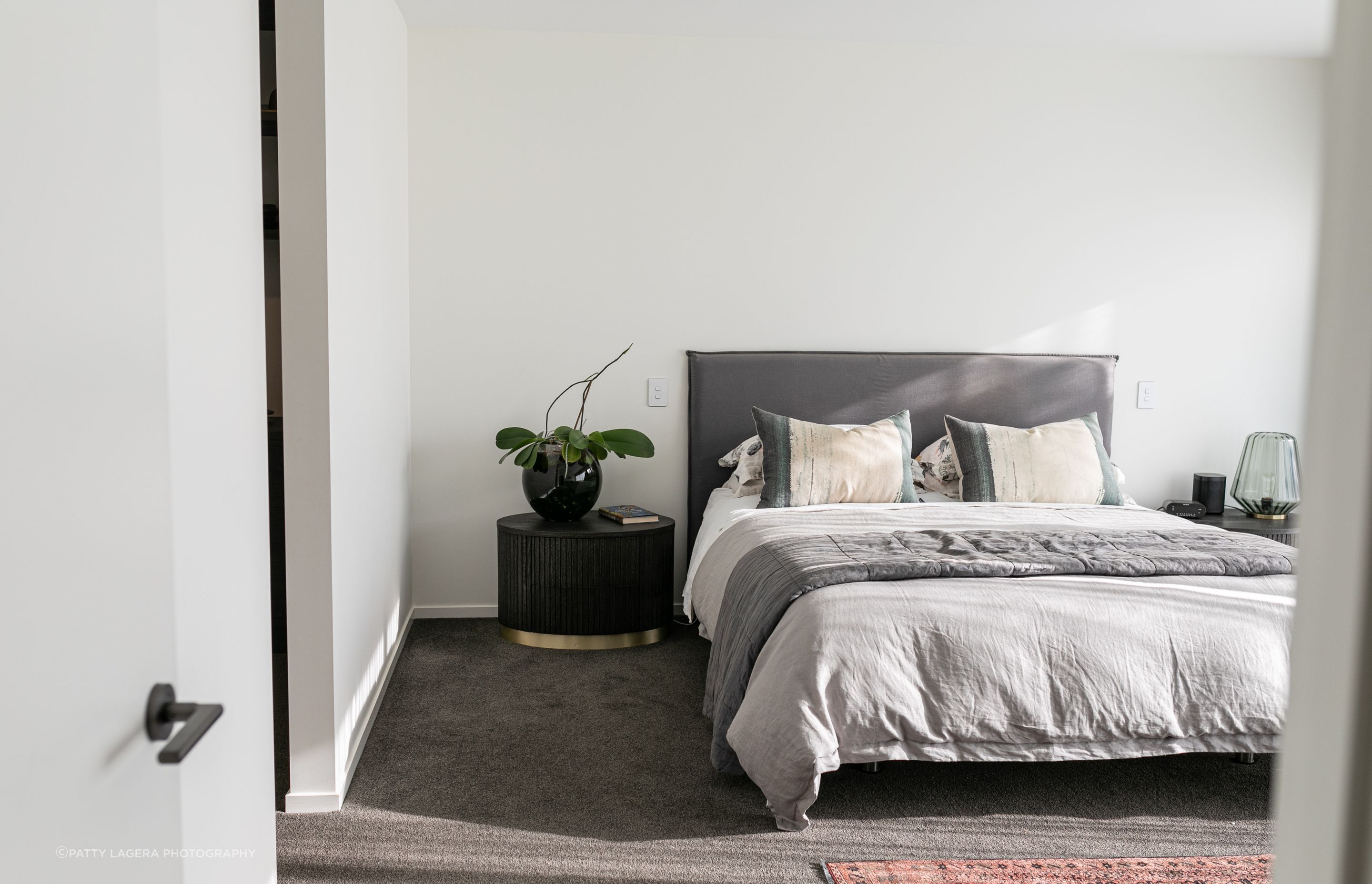 Neutral tones help the master bedroom to feel like a peaceful retreat.
