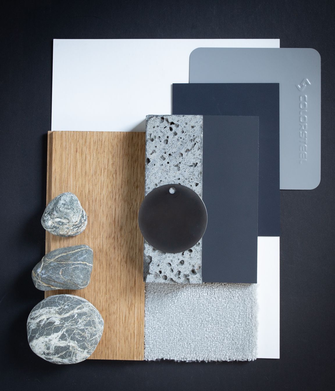 Colour: Sandstone Grey is a cool grey reminiscent of shadows on snow. In this palette they are offset against warm oak flooring, in a similar way to the evening sun warming the mountain ranges at the end of the day. The grains in natural stone, soft grey carpets, and clean blues create a cool fresh palette reflective of mountain regions and lakeside homes.