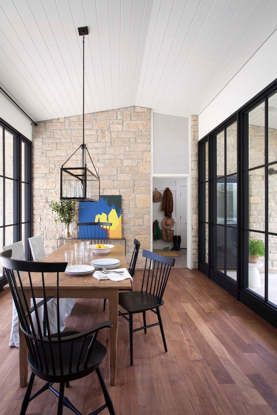 07BunnyRunCuppettKilpatrickArchitectureandInteriorDesignaustin-tx-dining-area-steel-windows-stone-wall.jpg