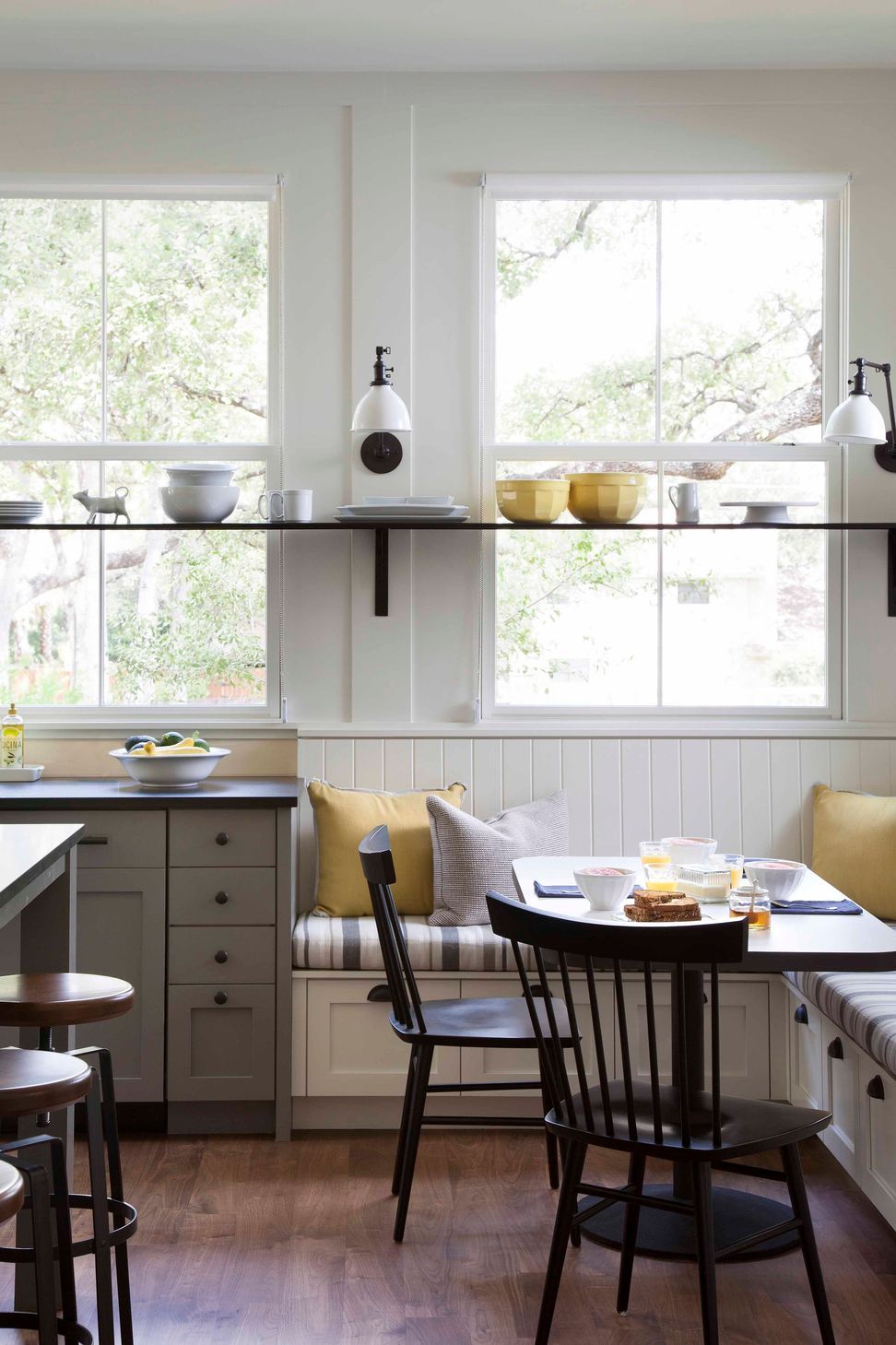 10BunnyRunCuppettKilpatrickArchitectureandInteriorDesignaustin-tx-kitchen-breakfast-nook-steel-shelf-sconces-window.jpg