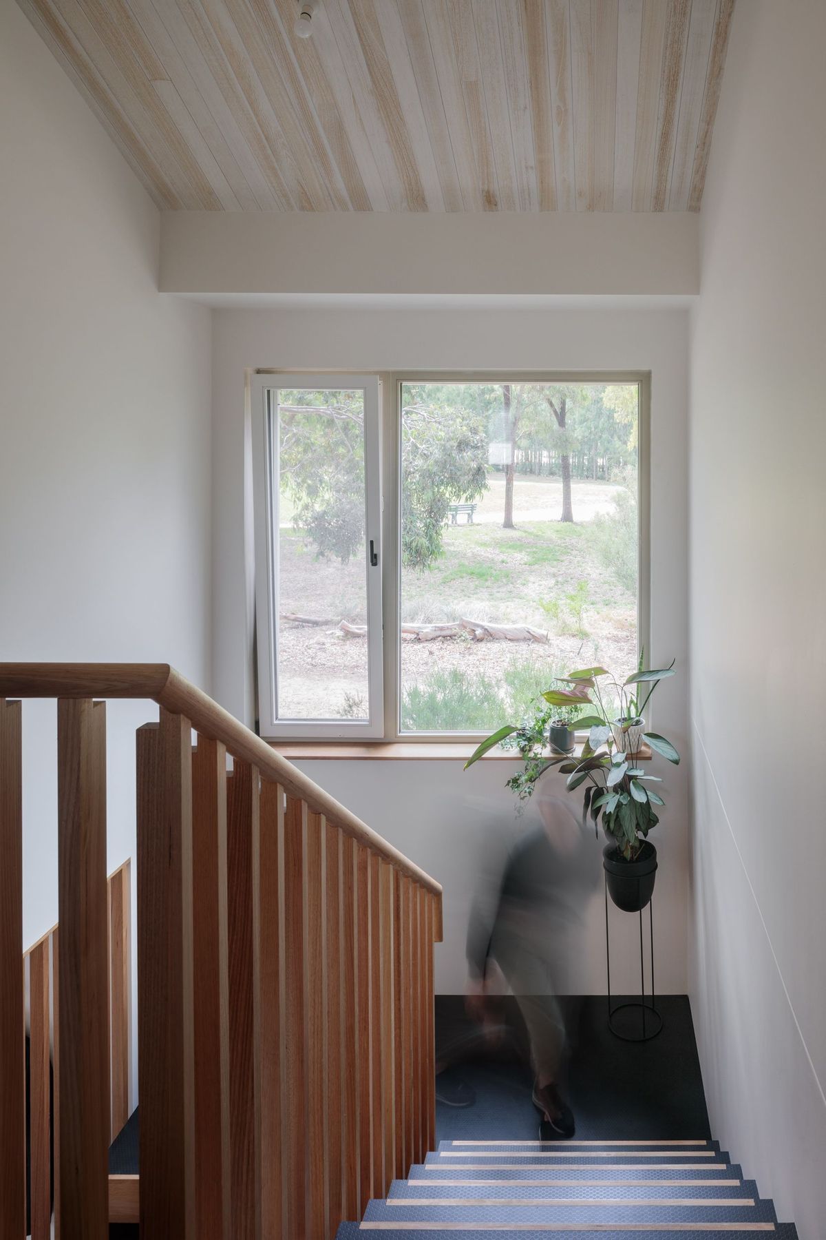 Staircase window with bi-fold opening, bringing in light and air