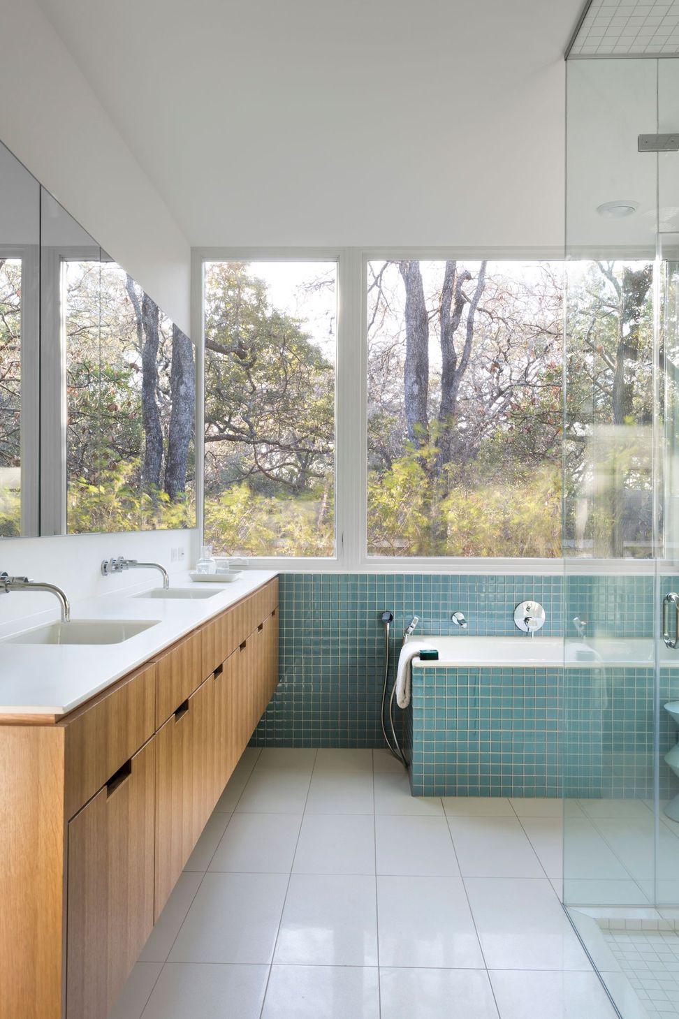 12RiverRoadCuppettKilpatrickArchitectureandInteriorDesignaustin-tx-main-bathroom-modern-wooden-vanity-teal-tiles.jpg