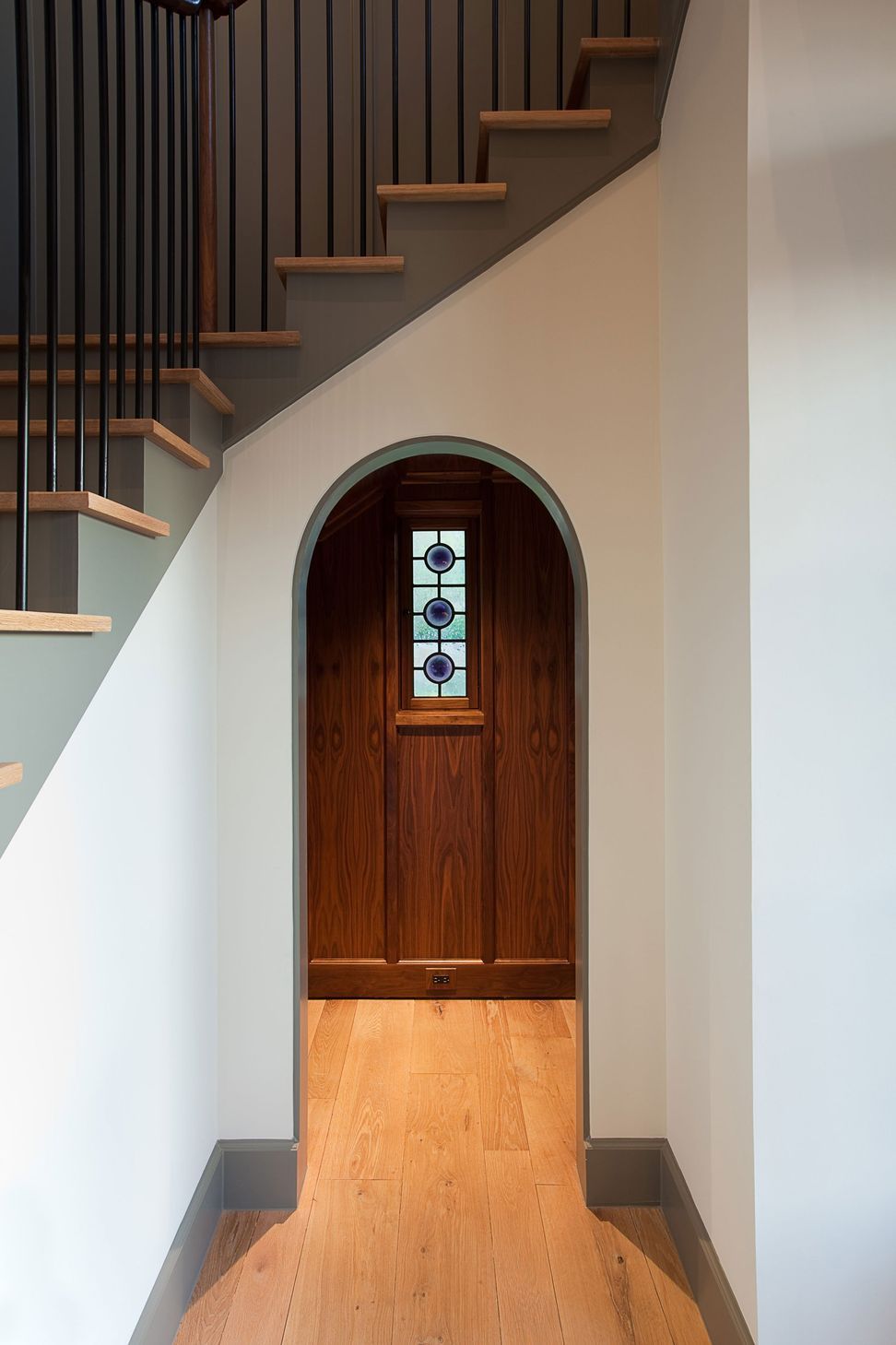 3UrbanHomesteadCuppettKilpatrickArchitectureandInteriorDesignaustin-tx-arched-powder-room-entrance-wood-paneling.jpg