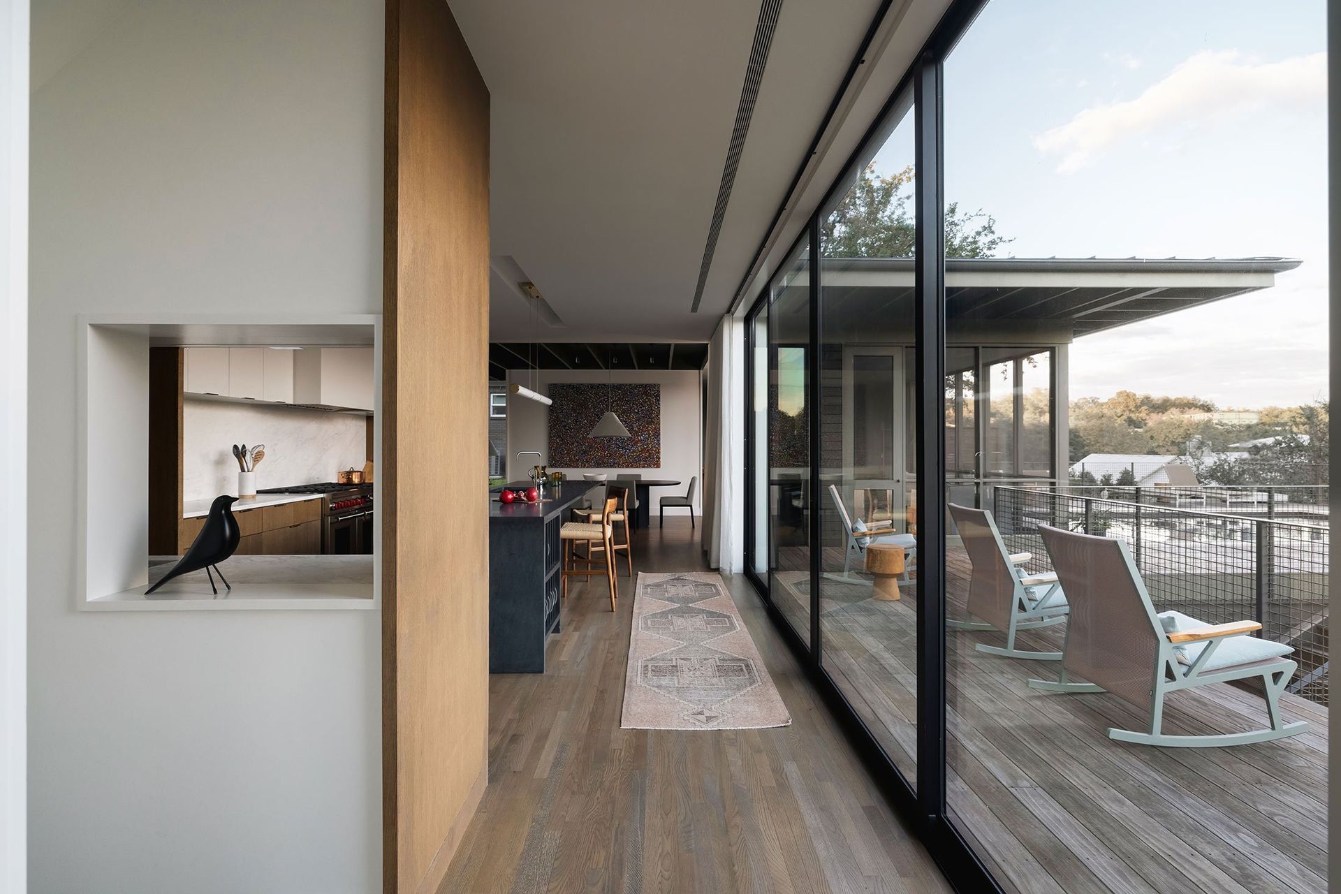 9RollingWoodCuppettKilpatrickArchitectureandInteriorDesignmodern-kitchen-dining-to-outdoor-deck-transition-architecture-1.jpg