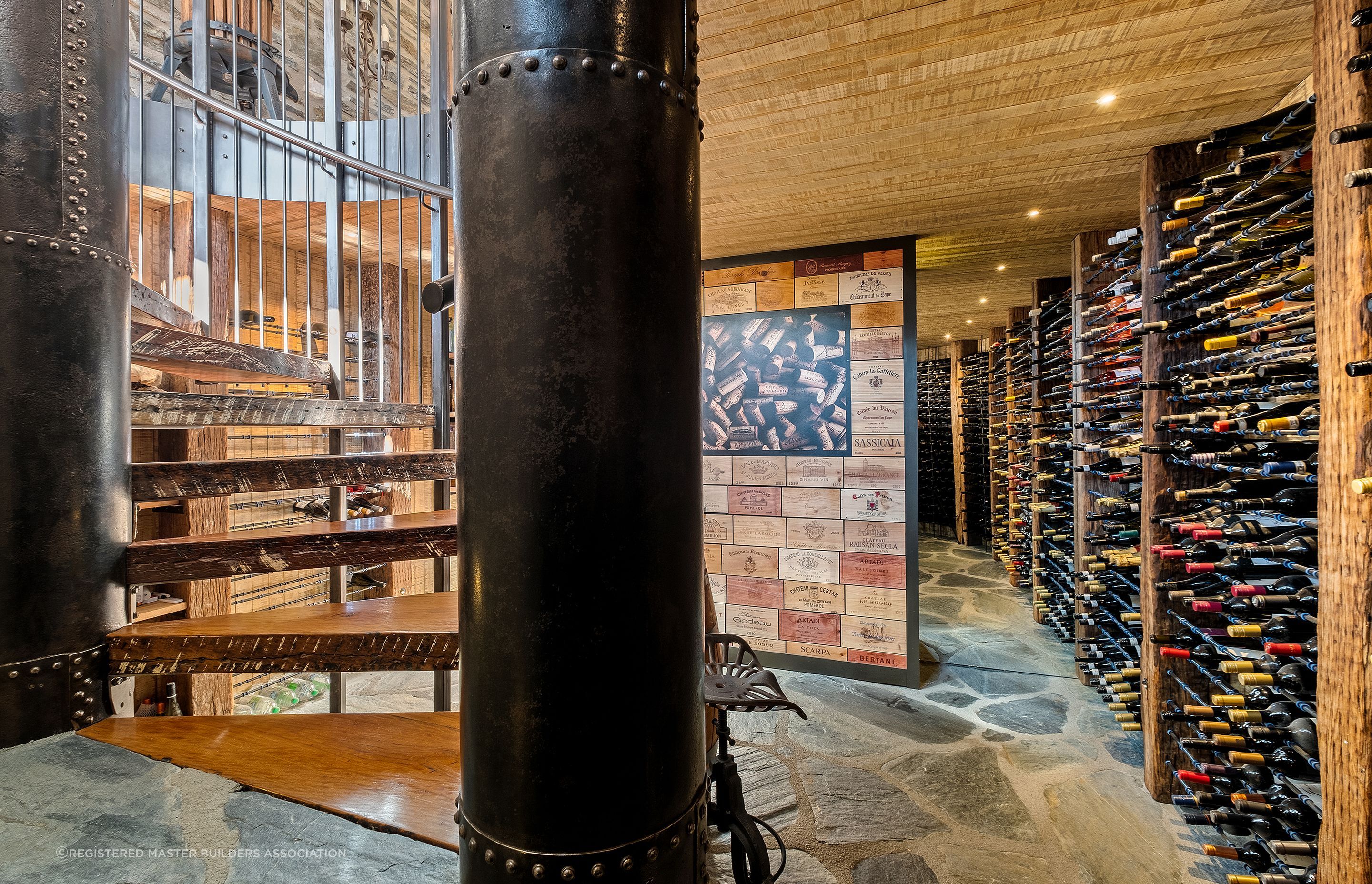 Bespoke staircase, with up-cycled timber treads and pillars created from steel irrigation pipes. Masterpiece!