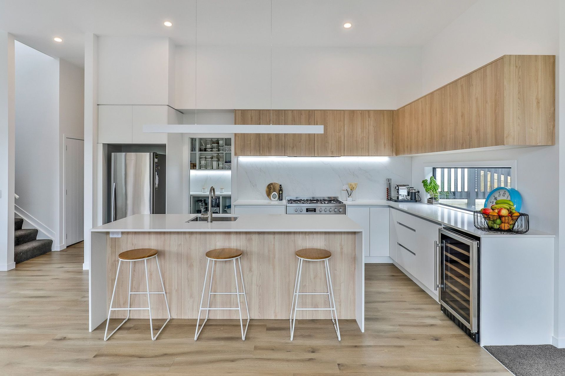 Neptune Elite Dune Birch SPC  128x1235mm flooring from The Tile Depot. Tiles used on splashback no longer available although a wide range of similar tiles are.