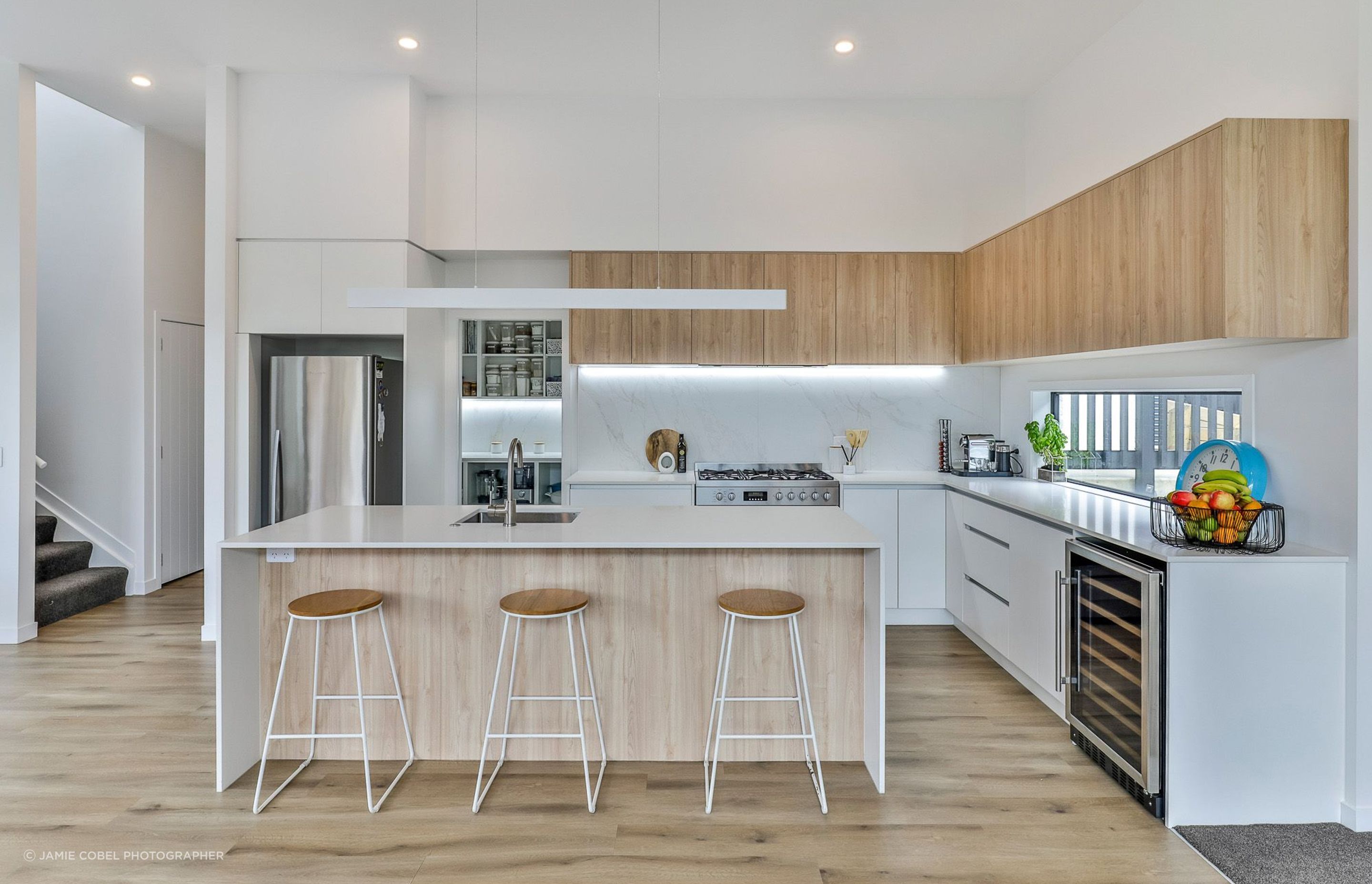 Neptune Elite Dune Birch SPC 128x1235mm flooring from The Tile Depot. Tiles used on splashback no longer available although a wide range of similar tiles are.