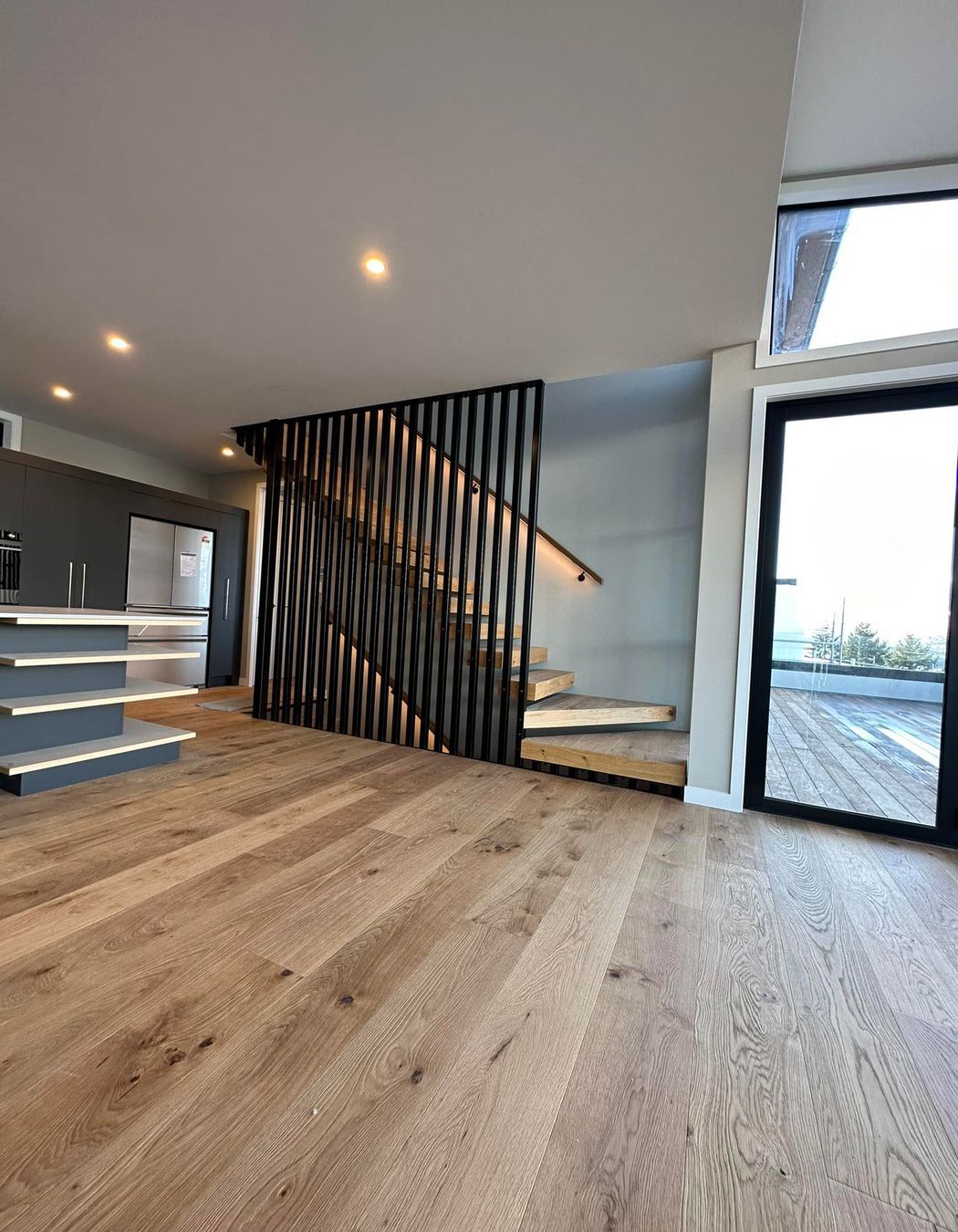 Black steel fins make for an amazing feature on the internal stairs