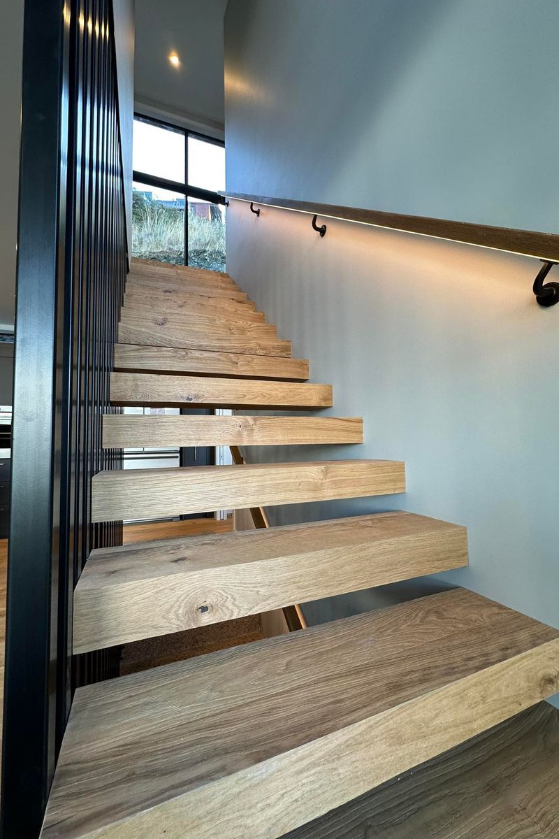 Floating internal stairs wrapped in Haro Oak flooring