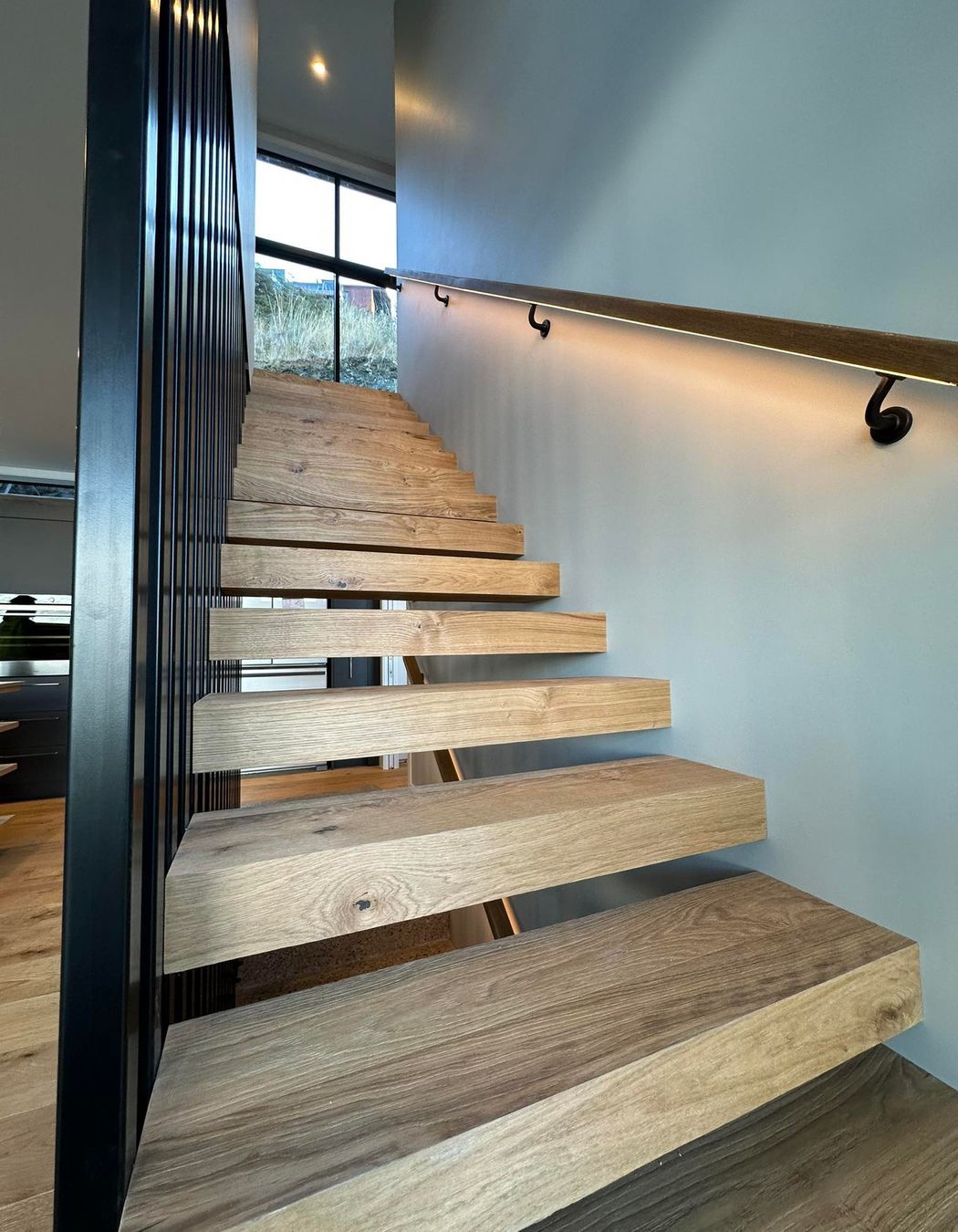 Floating internal stairs wrapped in Haro Oak flooring