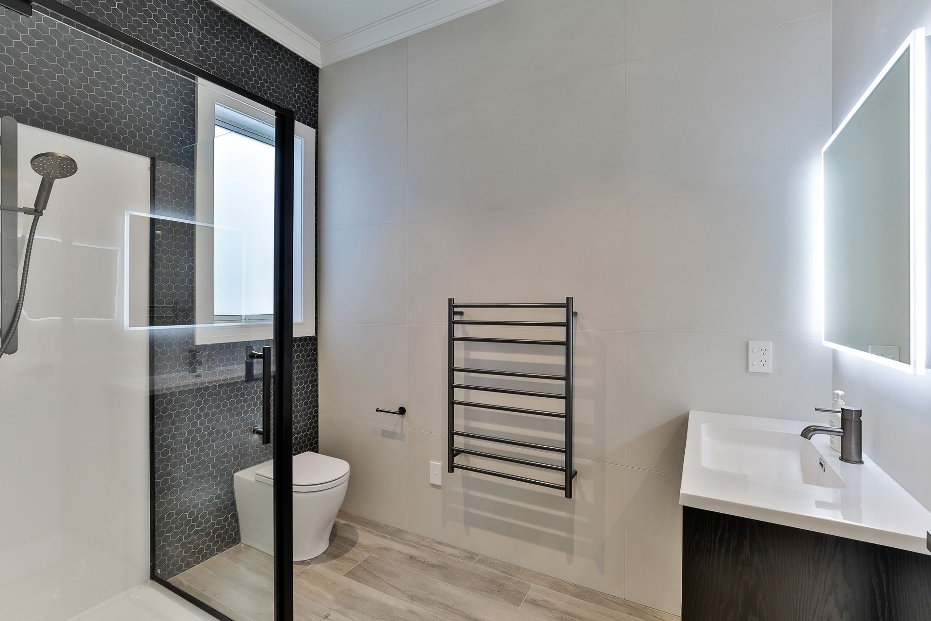 Amber Grey 200x1200mm porcelain, Urban Cement White Alyssum 600x1200mm and Beton Still Black Swan Hex mosaic wall