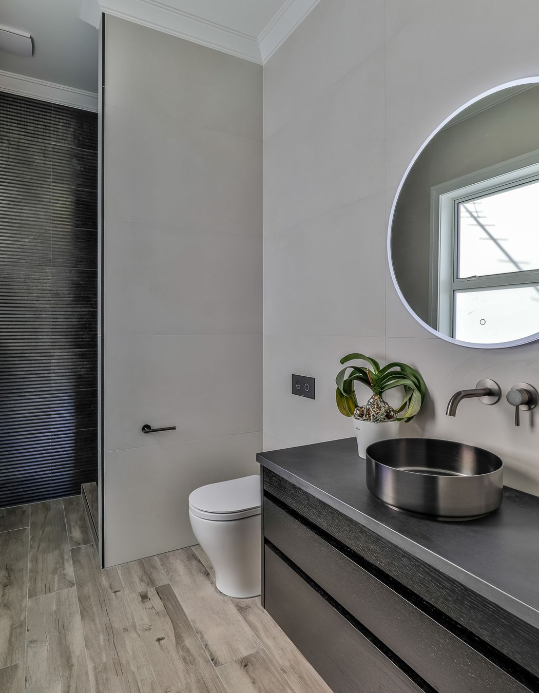 Amber Grey 200x1200mm floor, Urban Cement White Alyssum 600x1200mm and Vulcanika Raku Kaptur Nero on walls.