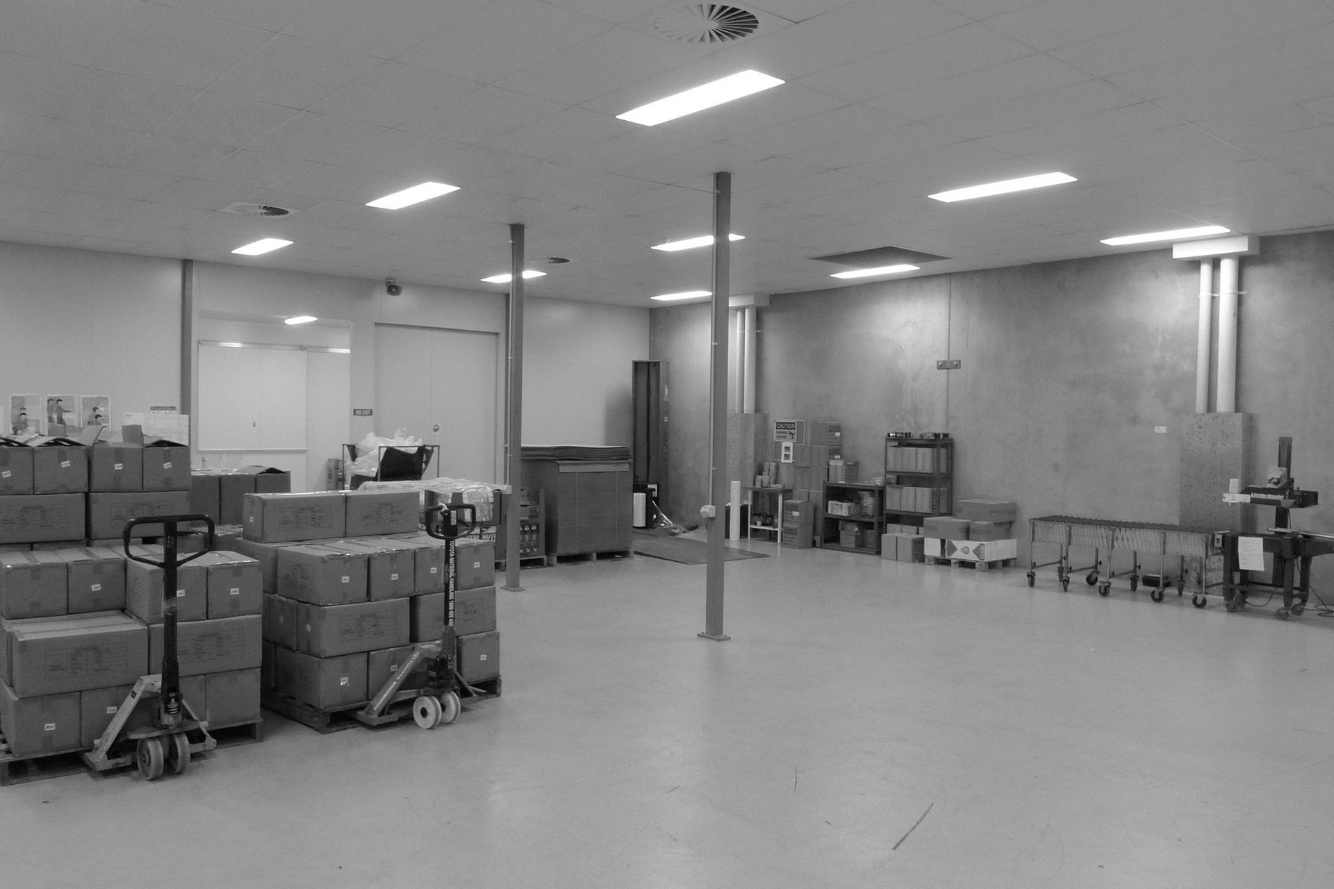 Well lit modern factory area under the upper floor office areas with highly useful ceiling heights