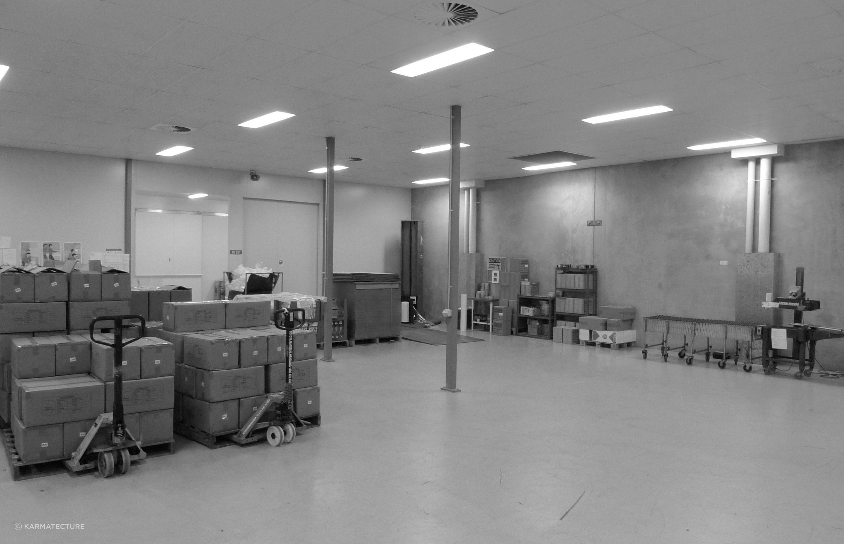Well lit modern factory area under the upper floor office areas with highly useful ceiling heights