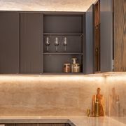 SlideLine M Inset in an overhead cabinet