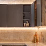 SlideLine M Inset in an overhead cabinet