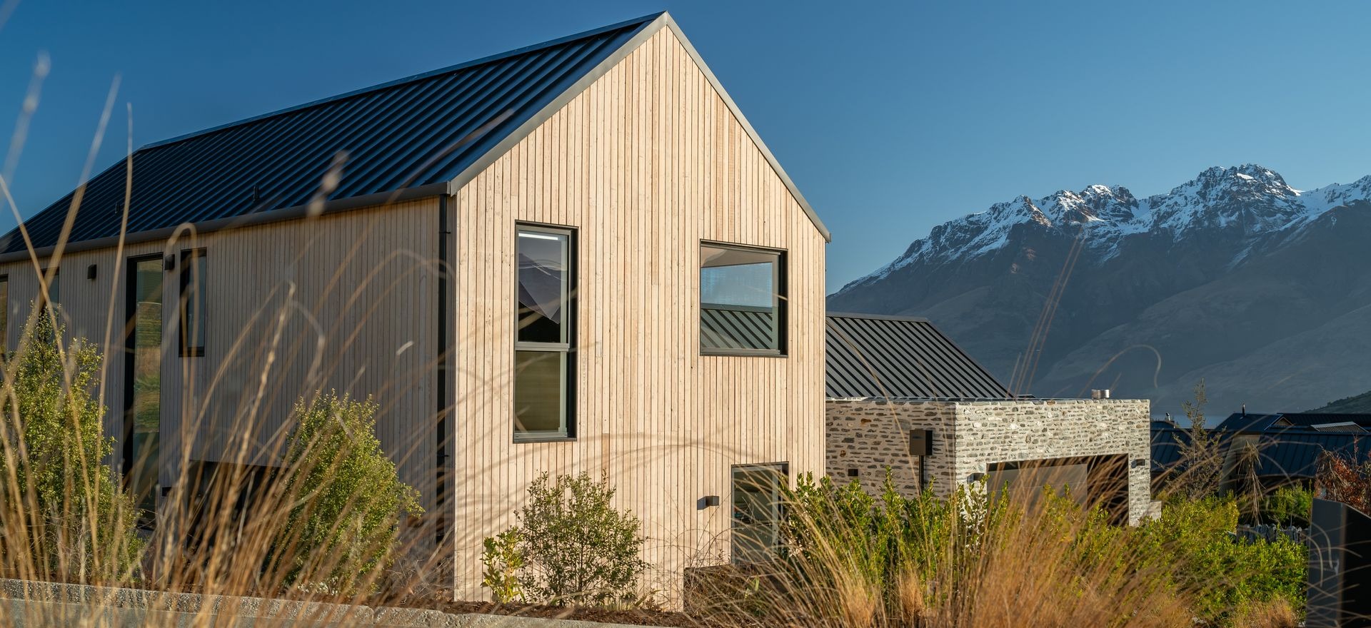 A gabled home framing mountain views in Queenstown