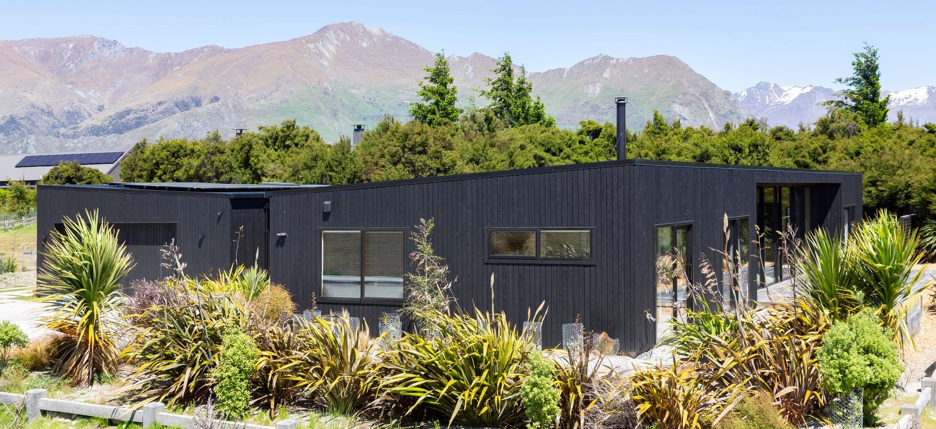 A jet-black mountain home protected by CUTEK