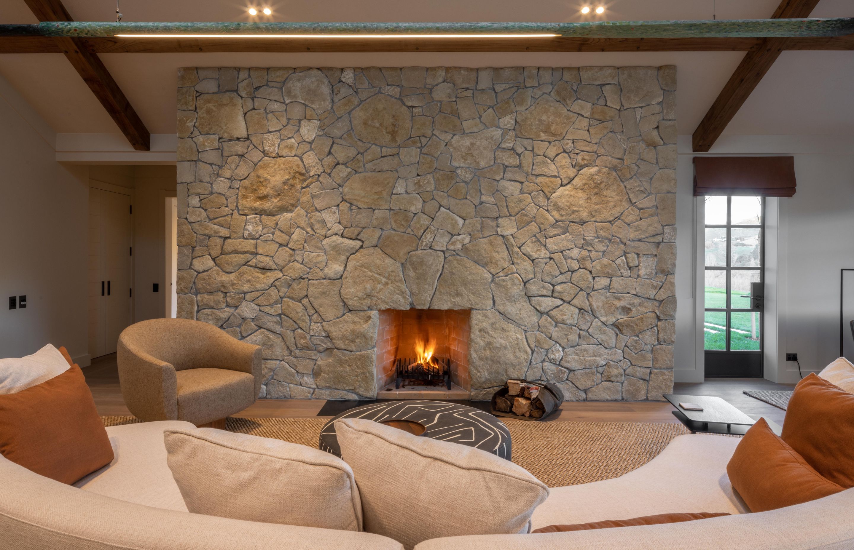 This fireplace installation features bespoke over-sized stones, helping it stand out.