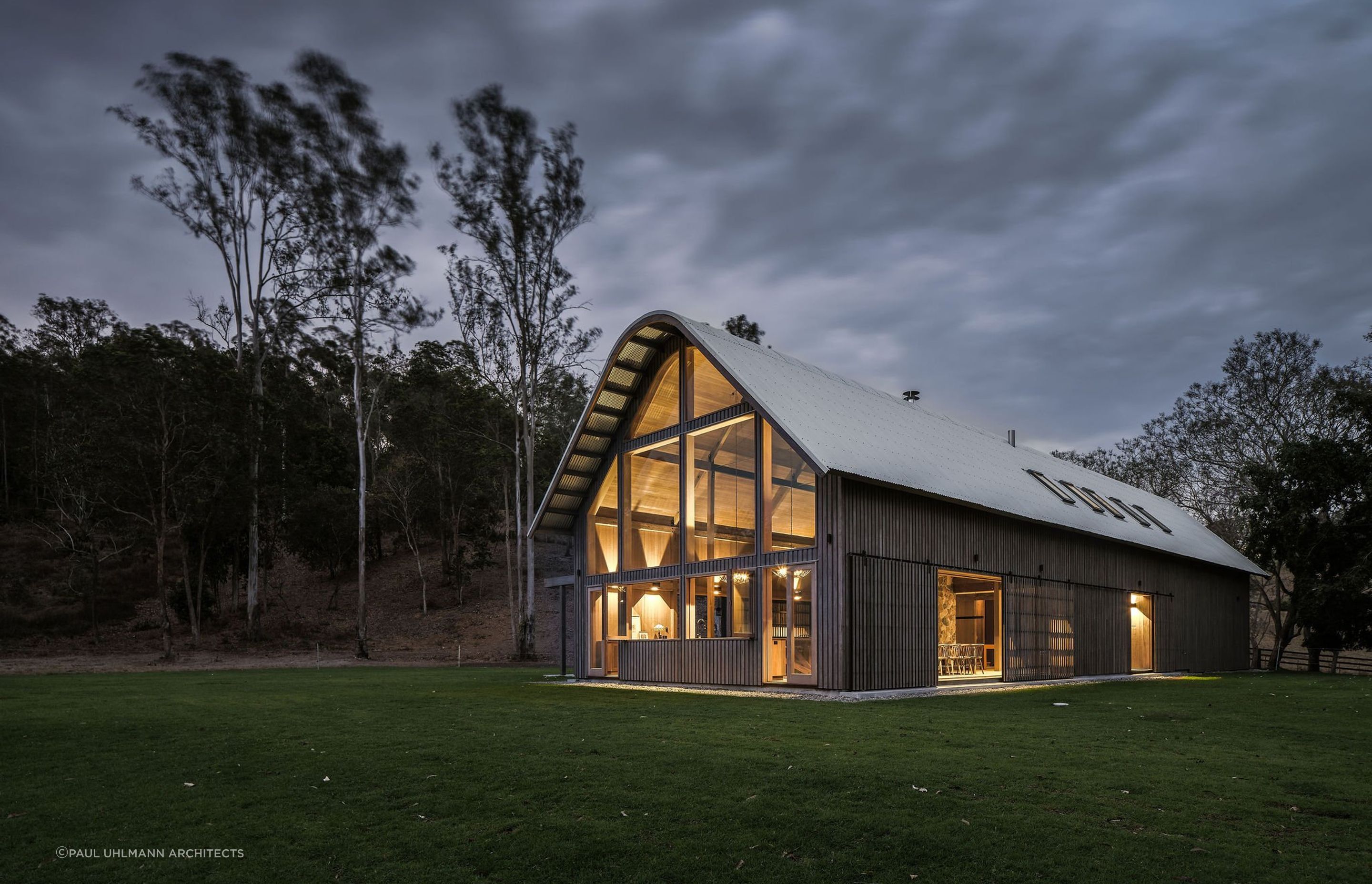A gambrel roof, characterised by its two-sided, dual-slope design, maximises space and adds a touch of vintage charm, reminiscent of classic barns or farmhouses. Featured project: The Barn