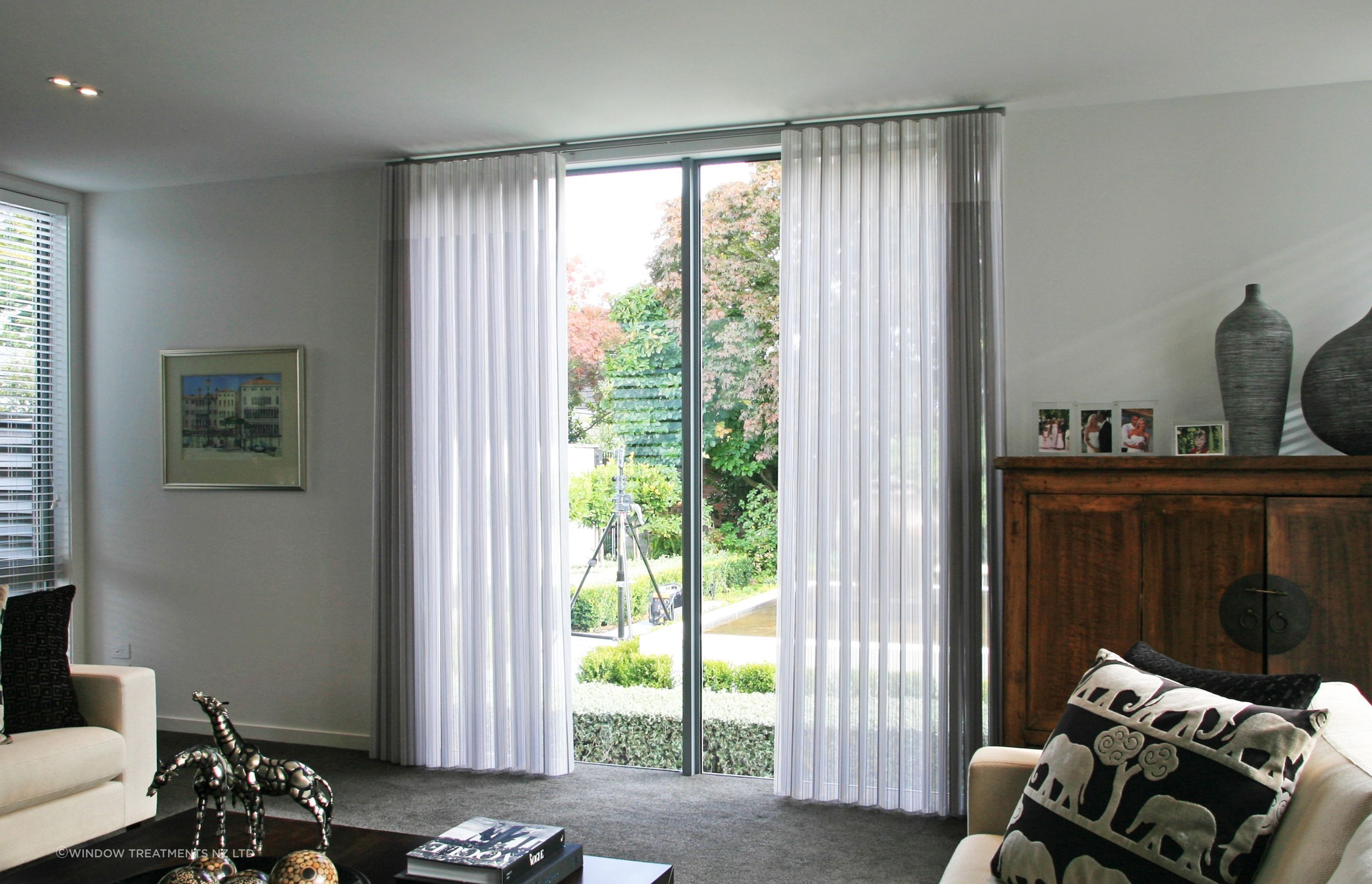 Curtains or blinds or something that's both, like the innovative Mystique Curtain/Blind.