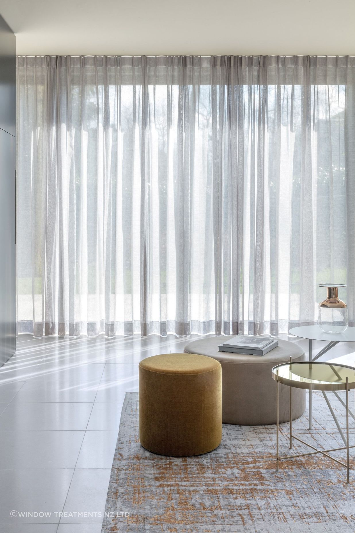 Custom made unlined sheer curtains elegantly enhance any space.