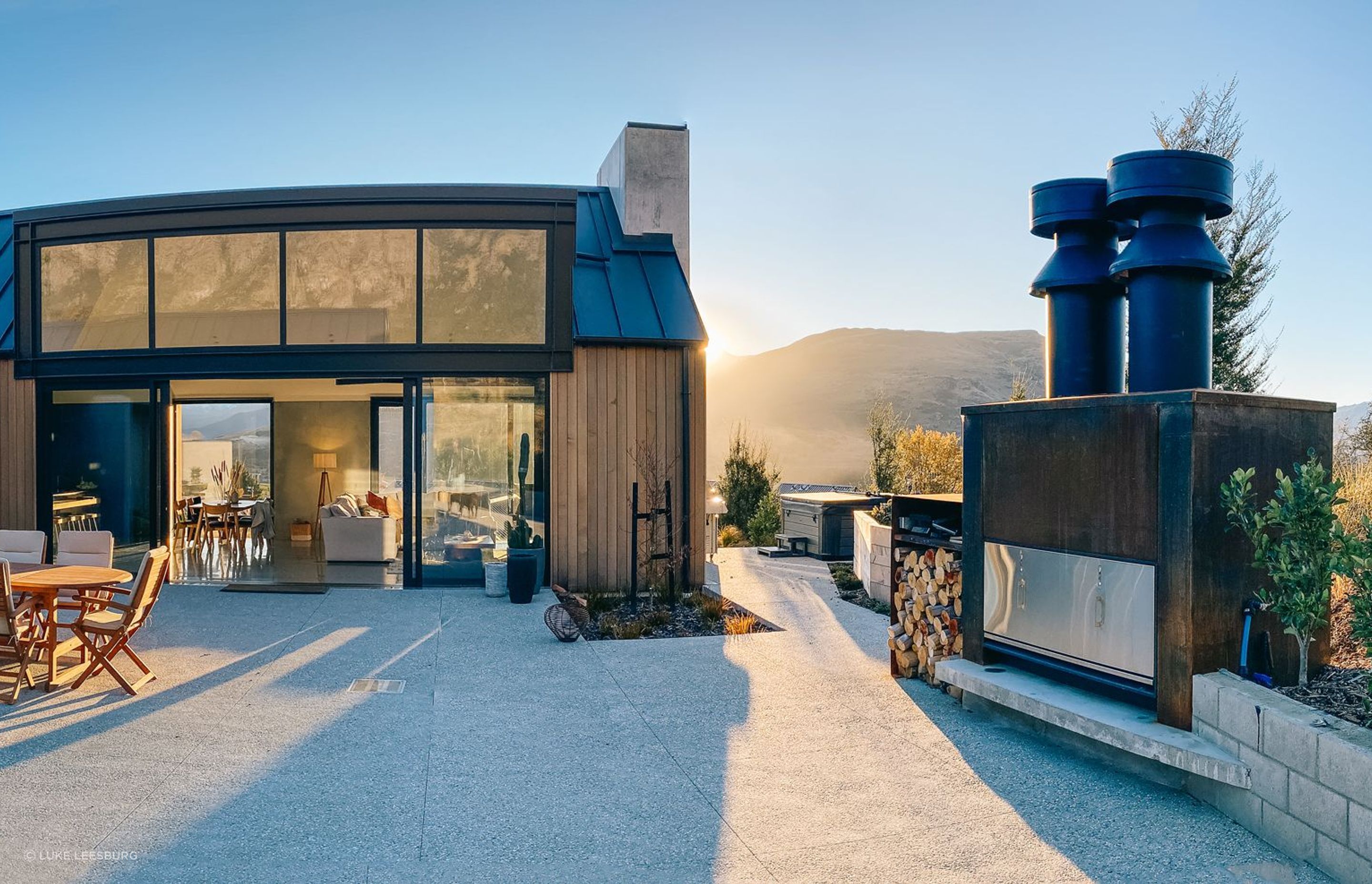 Image showcasing An industrial chic Queenstown residence built around a view of The ...