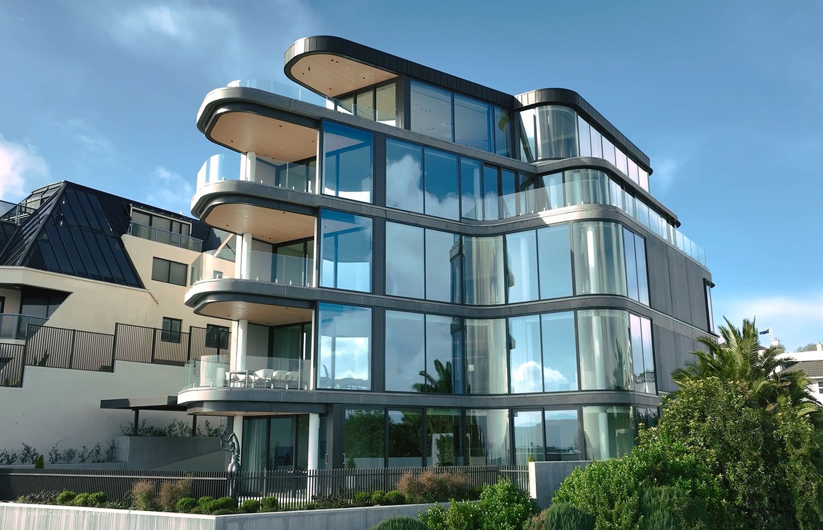 Image showcasing The Auckland apartments using curved glass to exude modern luxury ...