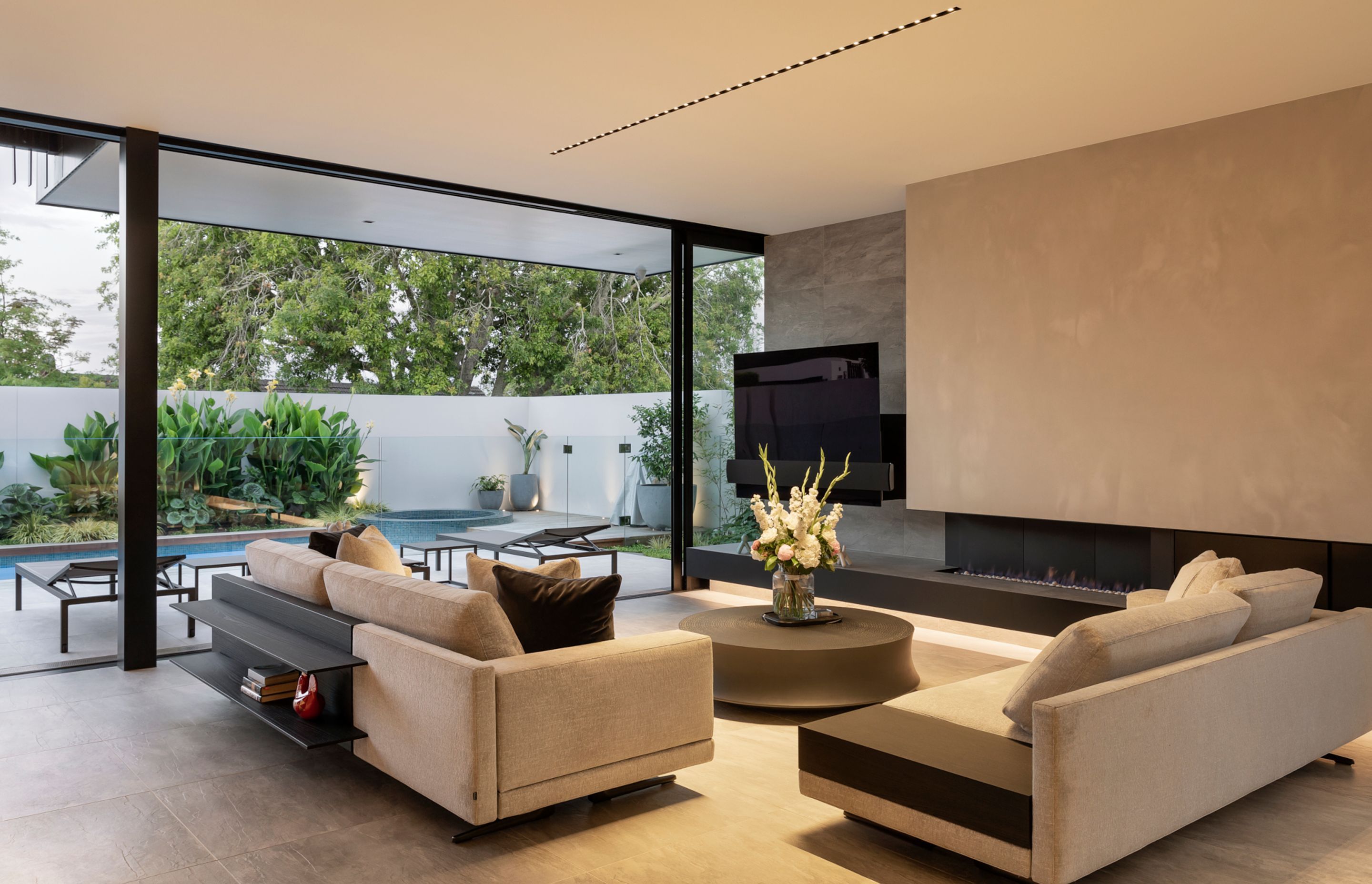 Huge sliding doors open up the lounge to the courtyard, effectively doubling the living space.