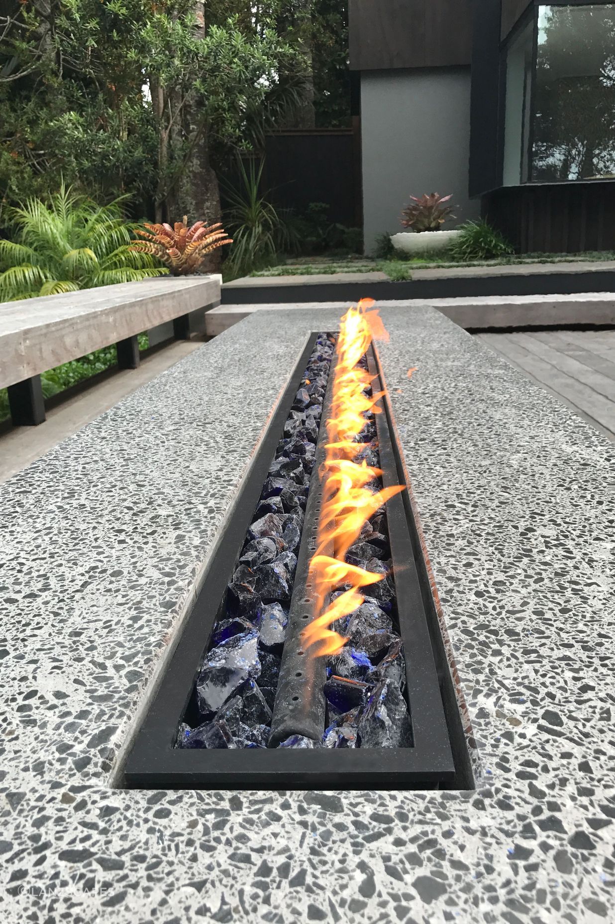 Fire pit table. Designed by lanzscapes