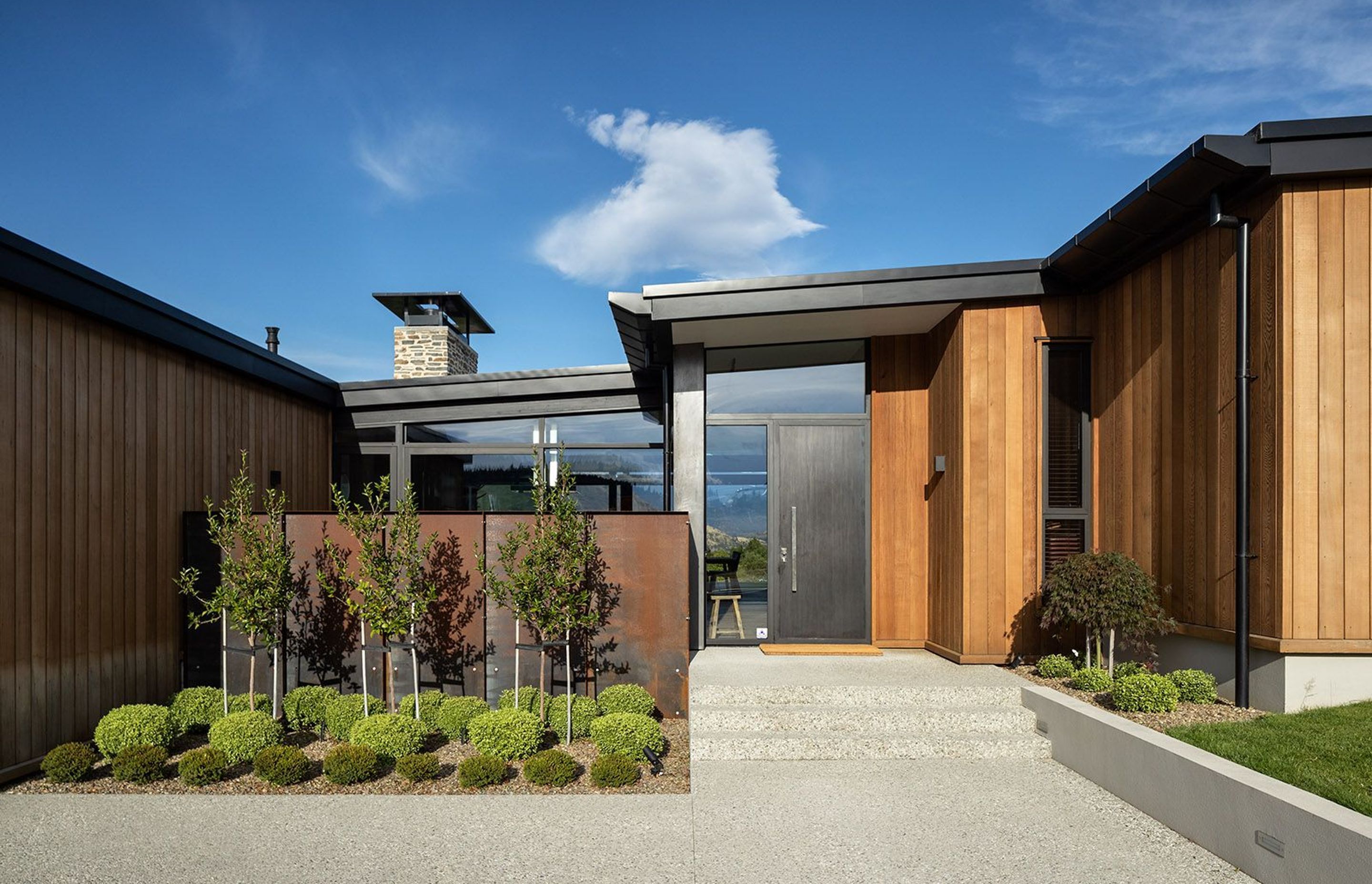 The mix of materials creates a contemporary feel for this Wanaka holiday home and also provides a high level of privacy from the street.
