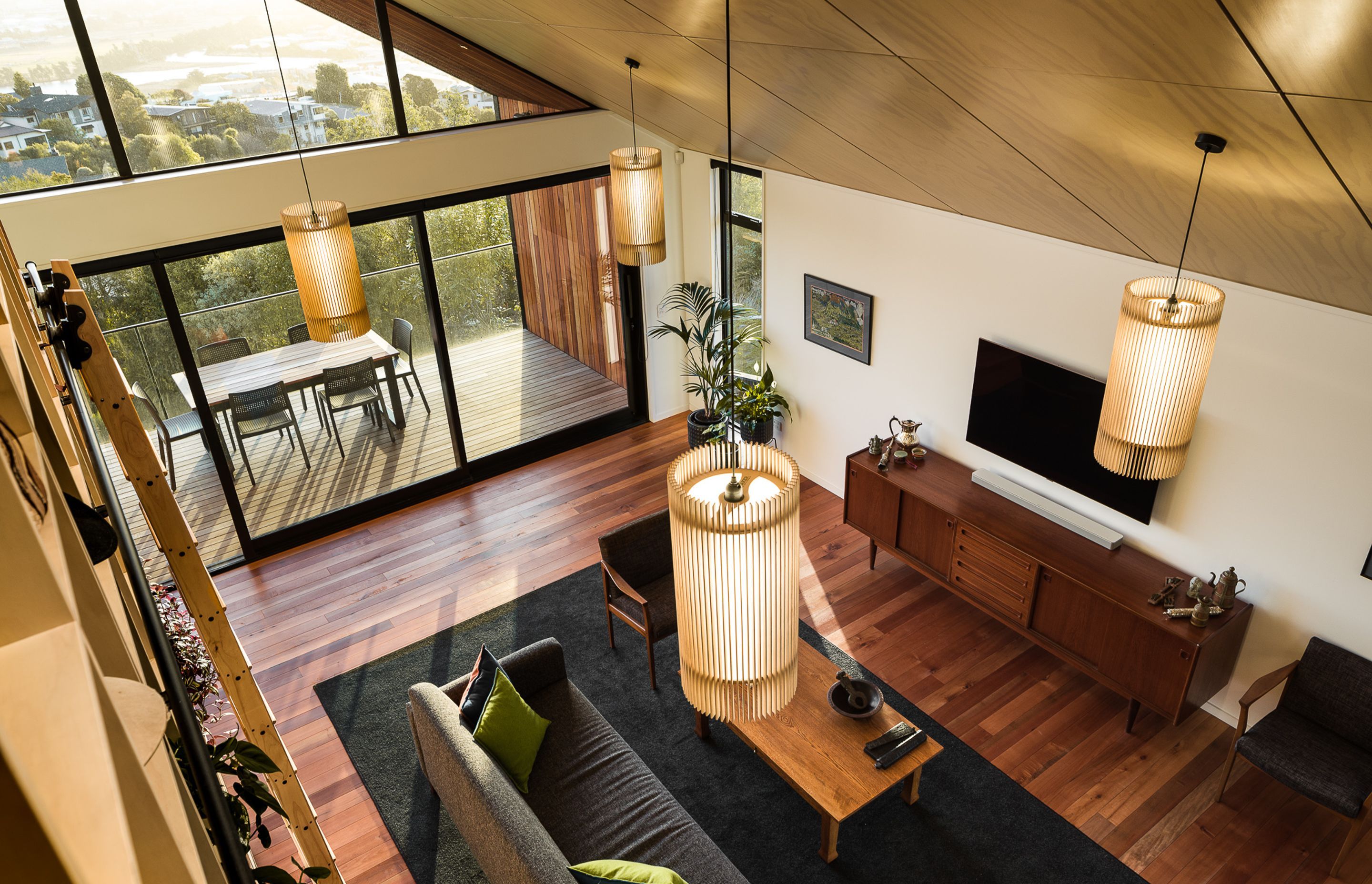 The double-height living area adds volumetric drama to the interior.