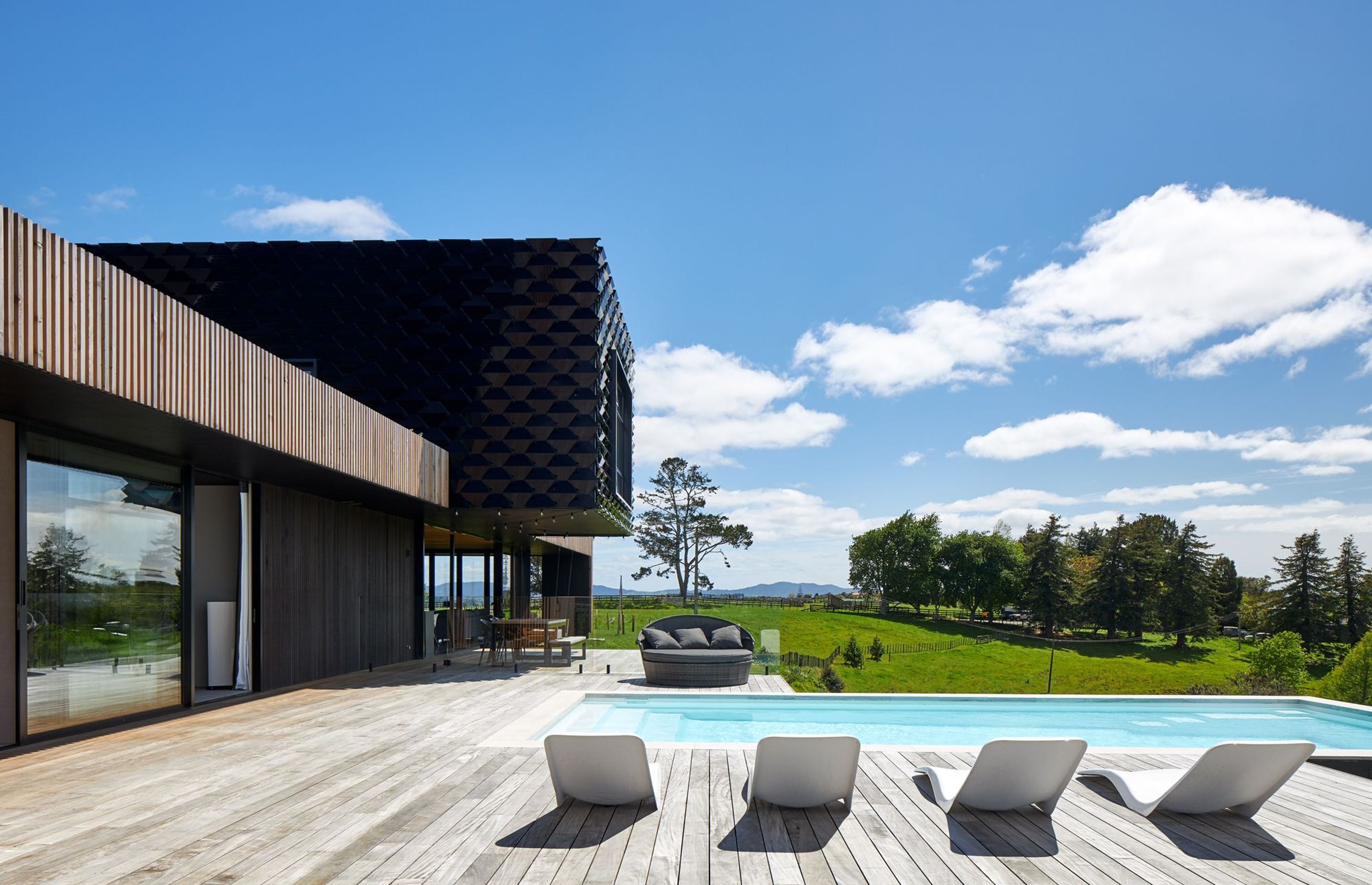 Architectural designer Noel Jessop and his wife Kylie bought an elevated section and designed their family home to take advantage of the natural setting and the wide-ranging views back towards the city.