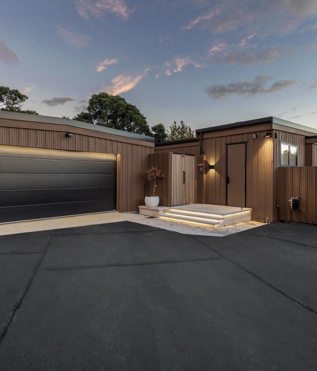 Meet the builders behind this cedar-clad home on the shores of Lake Pupuke