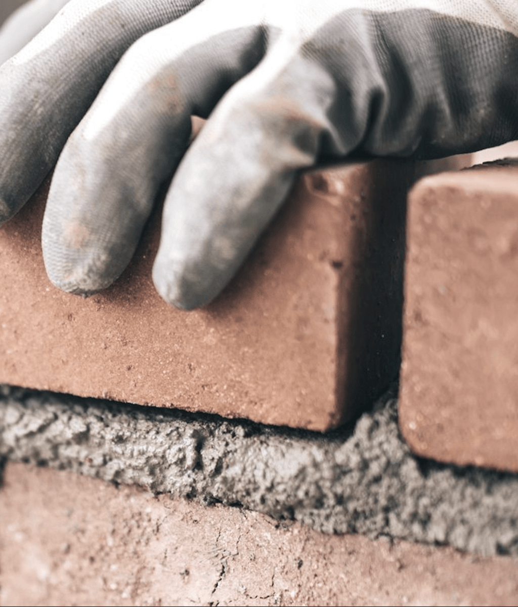 The bricklayers building the foundations for an ambitious affordable housing project