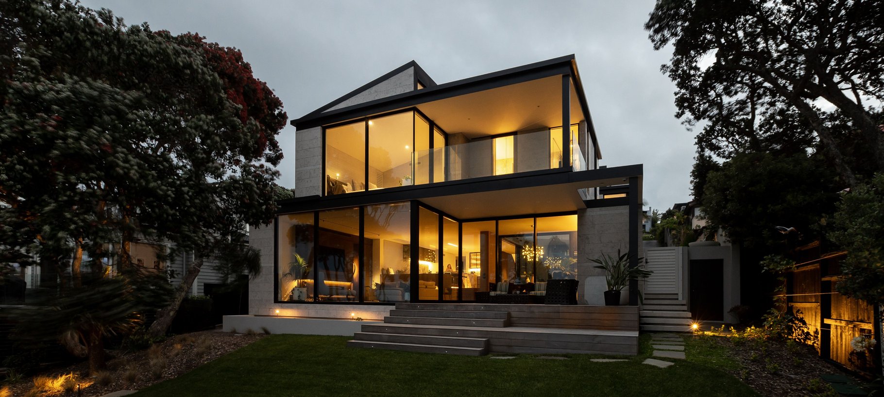 A clifftop residence inviting visitors down towards the sea | ArchiPro NZ