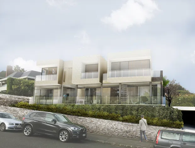 Street-level architectural rendering of a contemporary multi-storey residential building with a pale masonry facade, extensive glazed balconies and ground-floor glazing. The building sits above a landscaped hedge and stone retaining wall, with parked cars and a pedestrian in the foreground. A neighbouring pitched-roof house is partially visible to the left.