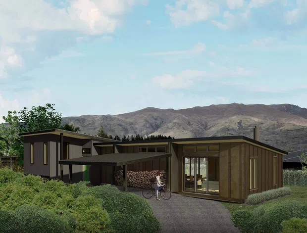 A low-profile modern house set in a landscaped suburban or semi-rural setting, with dark timber-clad volumes, broad low-pitched rooflines, extensive glazing, and a covered connecting entry or carport-like structure. A mountain ridge forms the background, while shrubs, trees, and a gravel path surround the home.